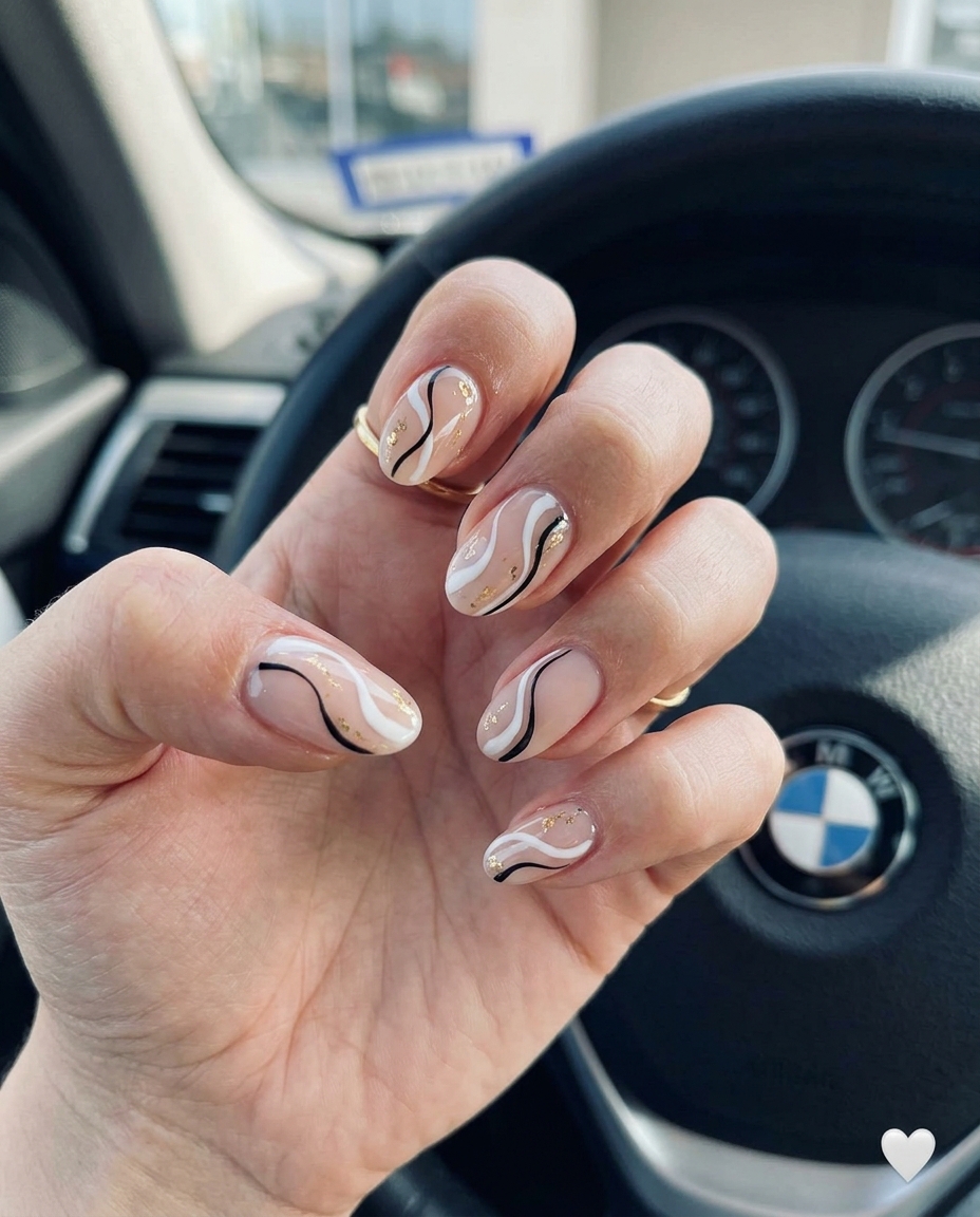 Abstract Swirl Nude Gold Nails 2026 | Boho Chic Abstract swirls on nude base with gold accents for trending summer nails 2026. Artistic bohemian casual style.