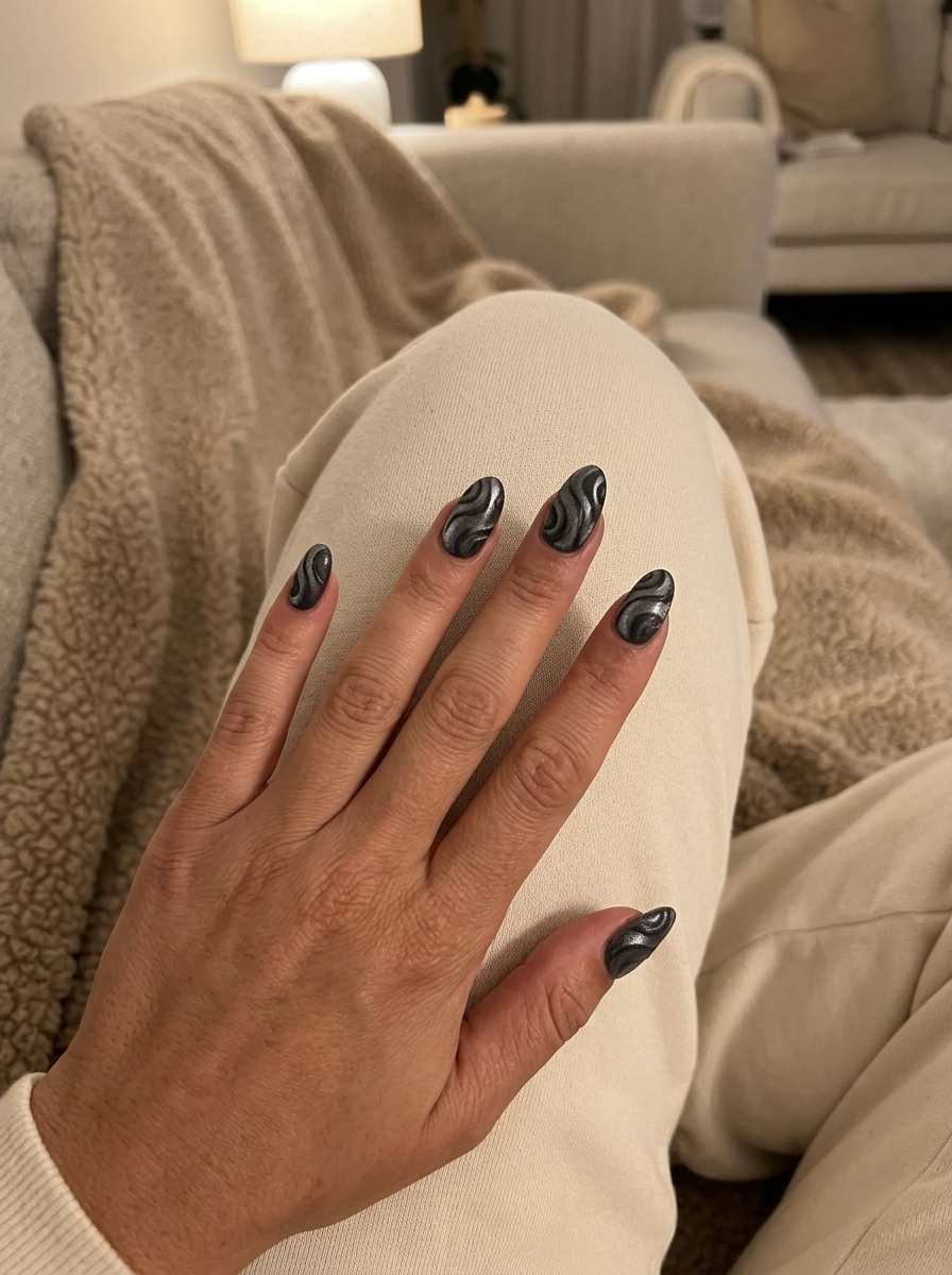 Trending Summer Nails 2026: Silver Velvet Swirls Trending summer nails 2026: Luxurious deep charcoal with silver velvet swirls for date night.