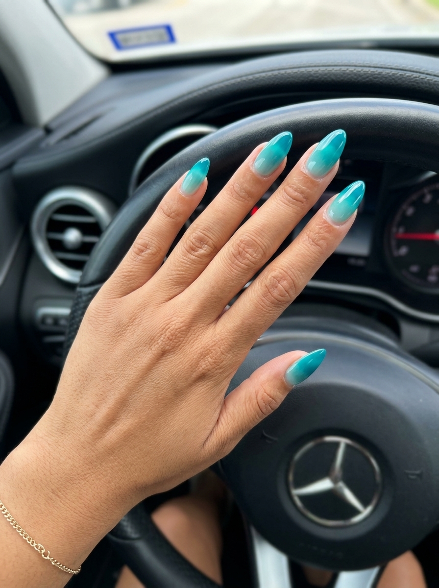Vivid Turquoise Jelly Gradient Nails 2026 | Futuristic Glam Vivid Turquoise Jelly Gradient nails: deep turquoise jelly gradient for vacations & parties. Tropical nail designs 2026.
