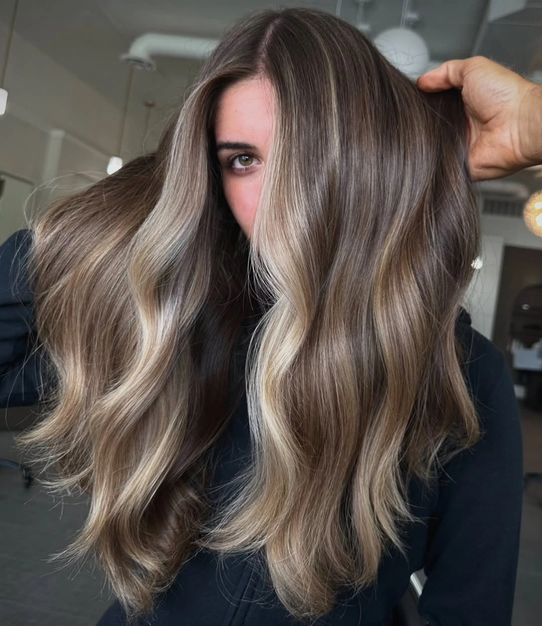 babylights hair ideas Glossy Mushroom Brunette With Seamless Babylights