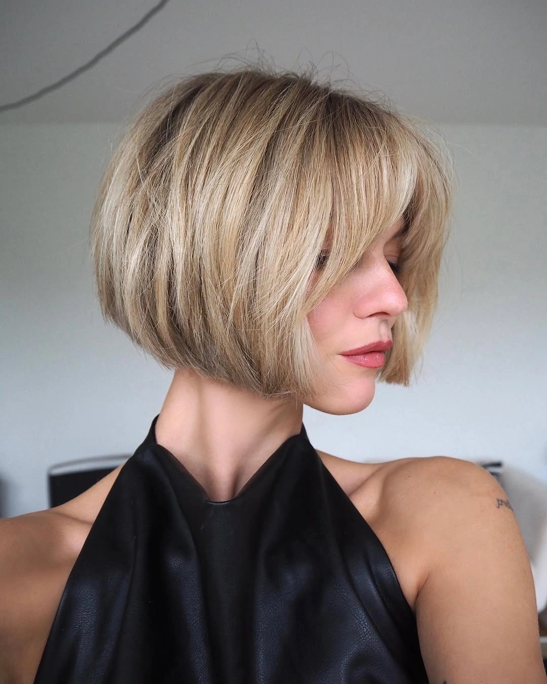 bobbed haircut for women Rounded Blonde Bob With Full Soft Bangs