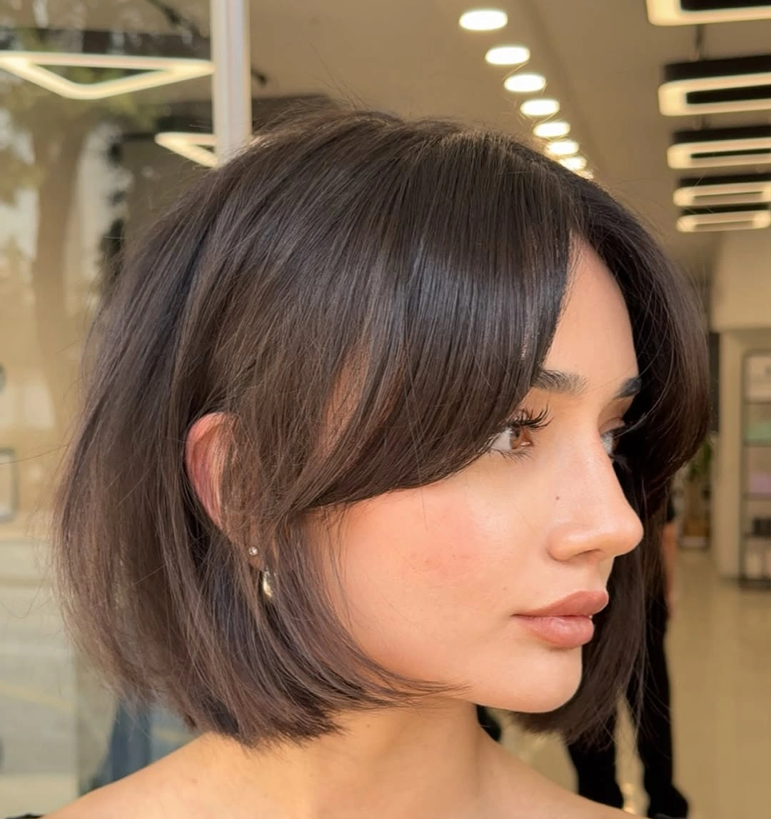bobbed haircut for women Elegant Brunette Bob With Face-Framing Layers