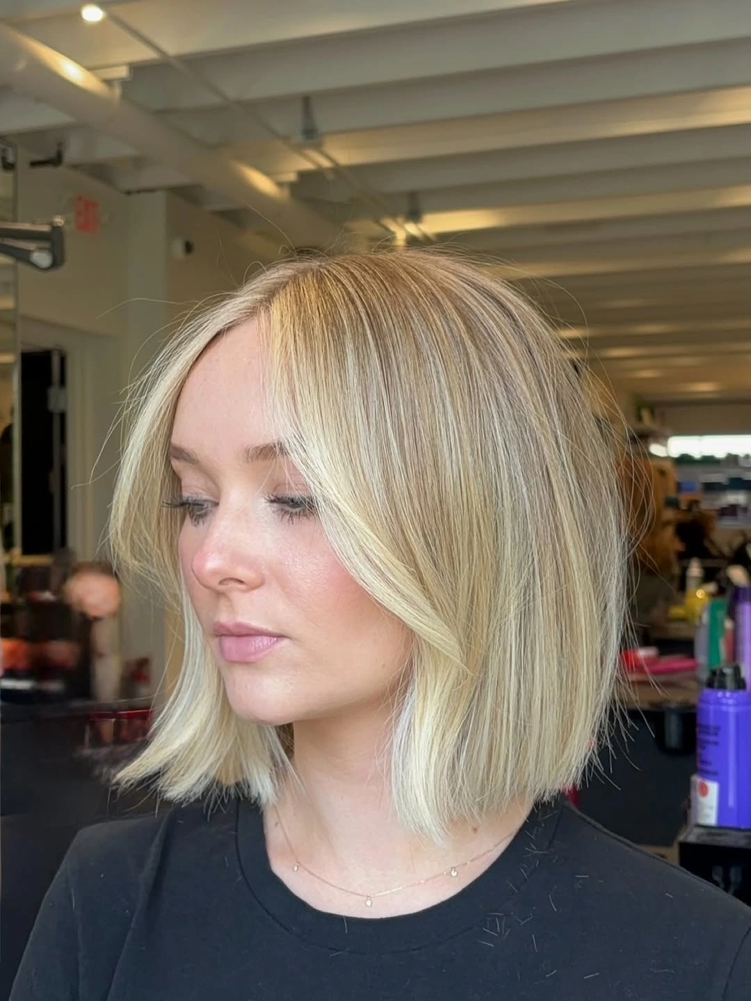 bobbed haircut for women Bright Blonde Bob With Curtain-Part Elegance