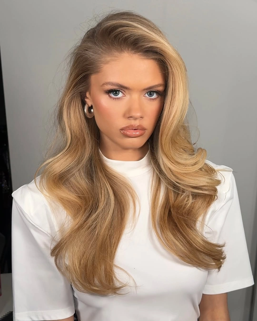 body waves hairstyle Soft Golden Blonde Waves With Elegant Side Volume