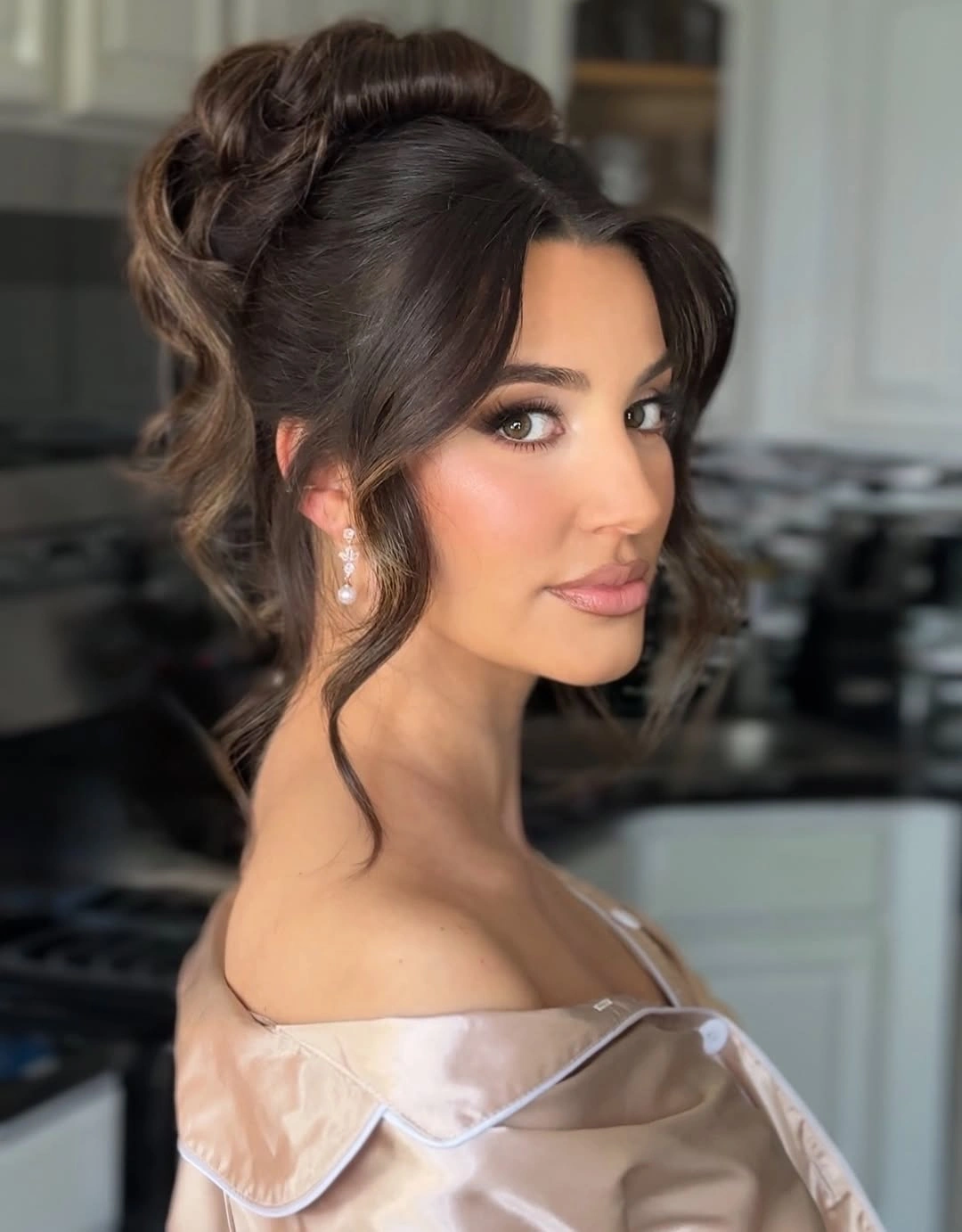 bridesmaid hairstyling Romantic Voluminous Updo With Curtain Bangs