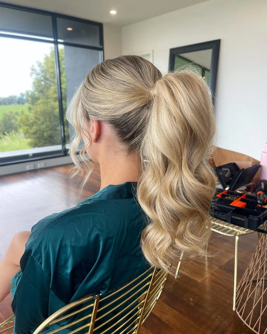 bridesmaid hairstyling Classic High Ponytail With Soft Hollywood Waves