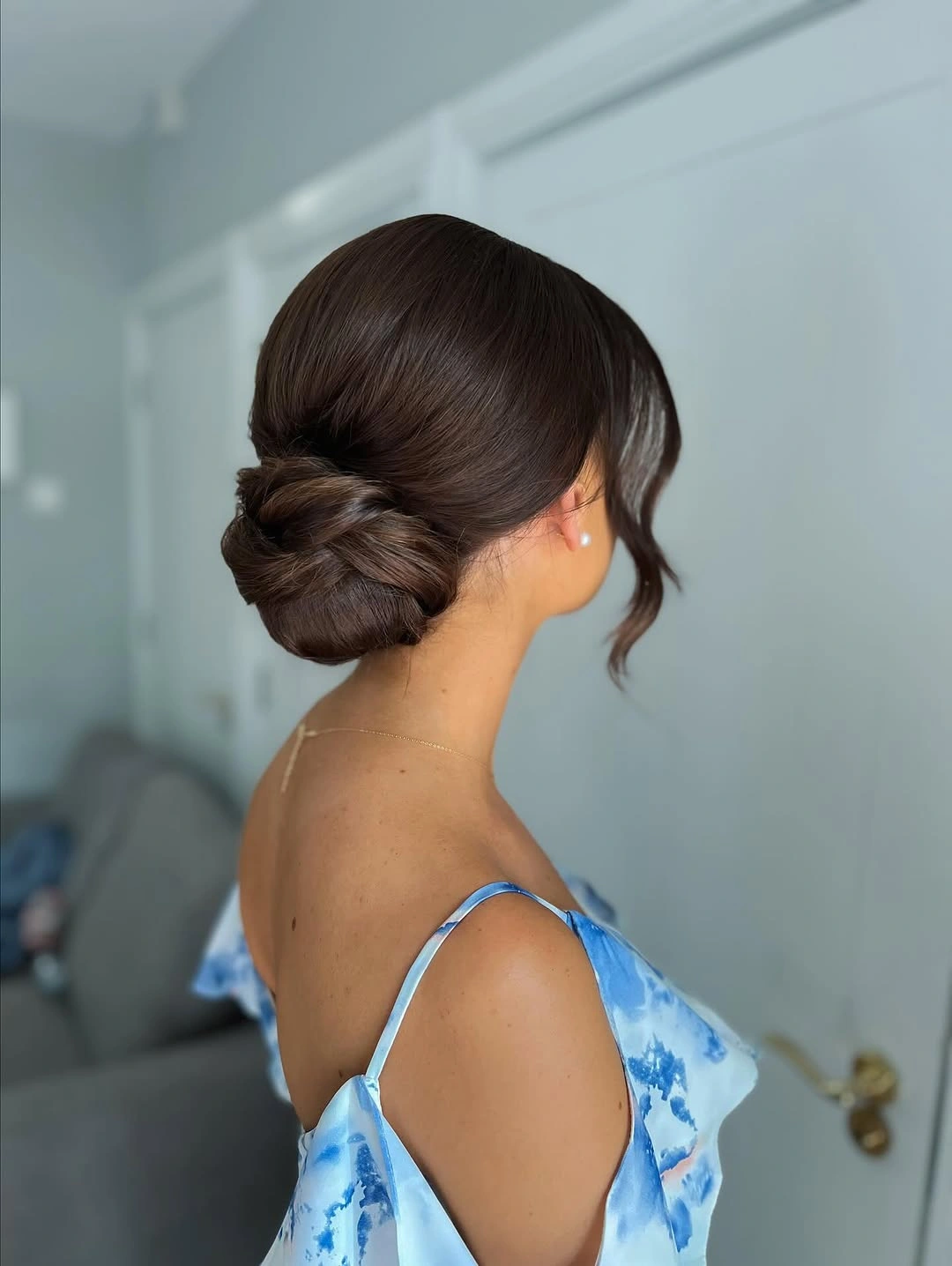 bridesmaid hairstyling Timeless Sleek Low Bun With Modern Sophistication
