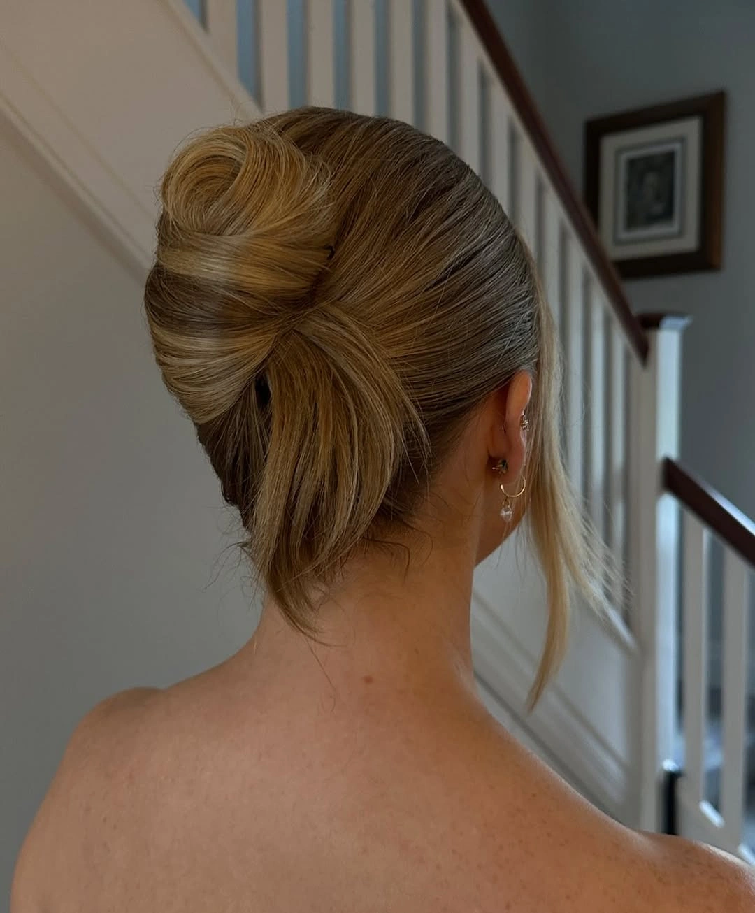 bridesmaid hairstyling Vintage Inspired French Roll With Soft Face Framing Layers