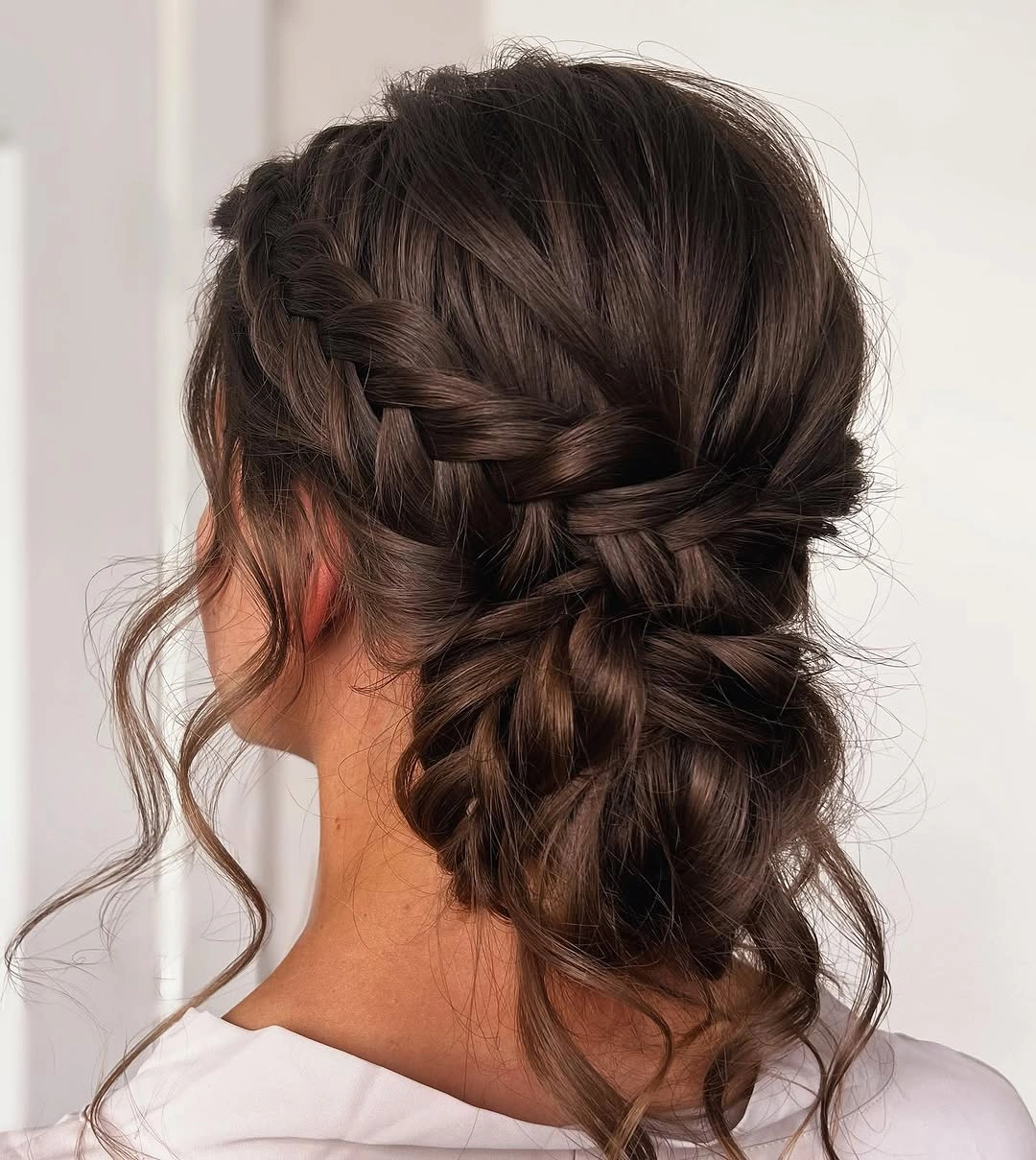 bridesmaid hairstyling Romantic Braided Low Updo That Feels Effortless