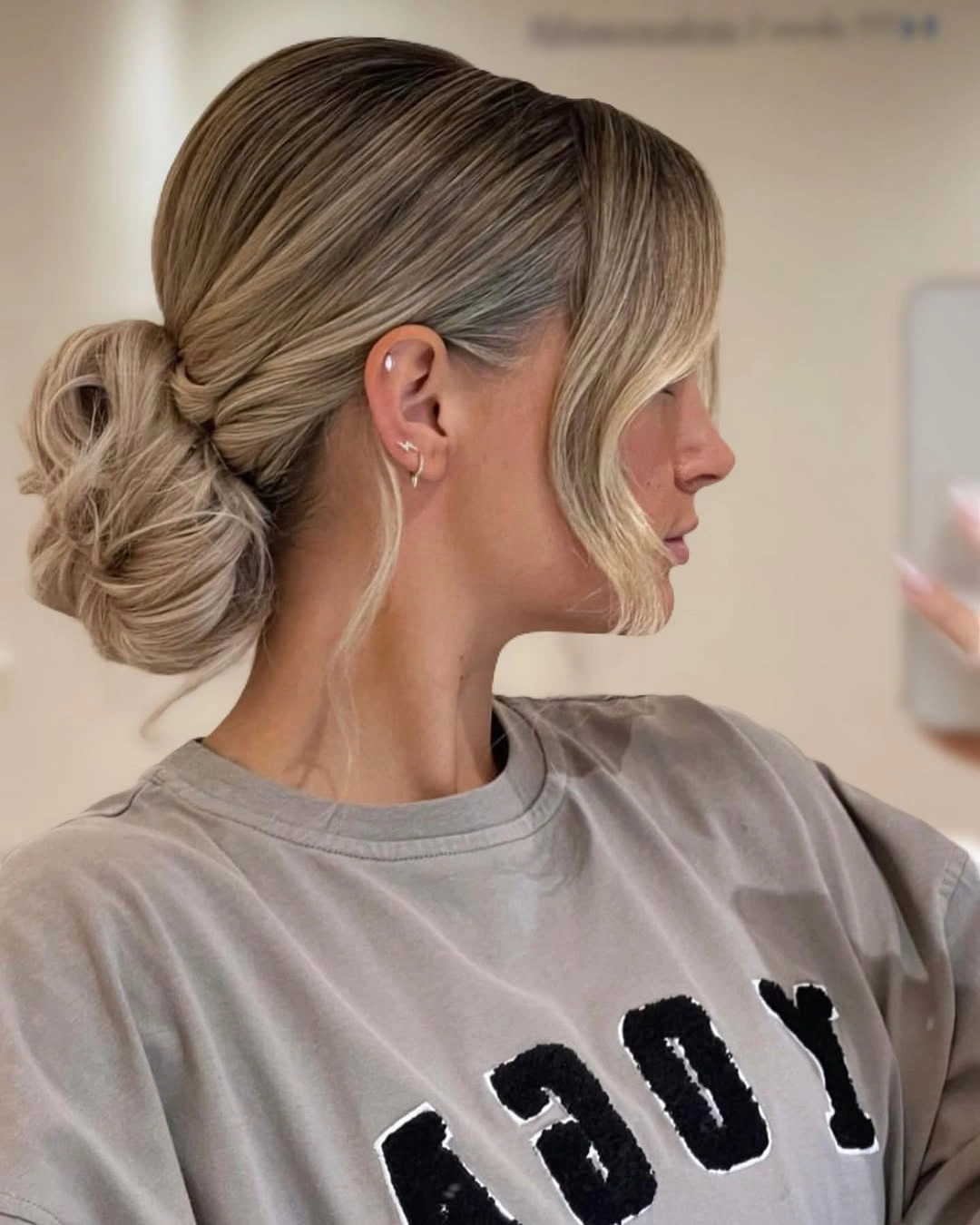 bridesmaid hairstyling Textured Low Bun With Sculpted Volume