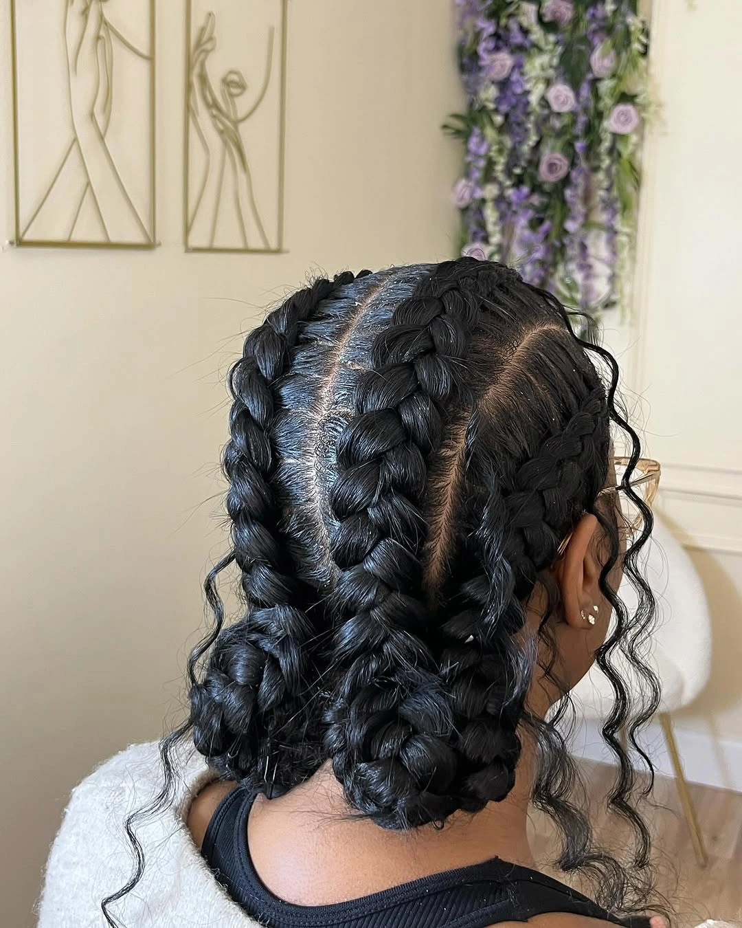 butterfly braids hairstyle Classic Butterfly Braids With a Sculpted Double Bun Finish