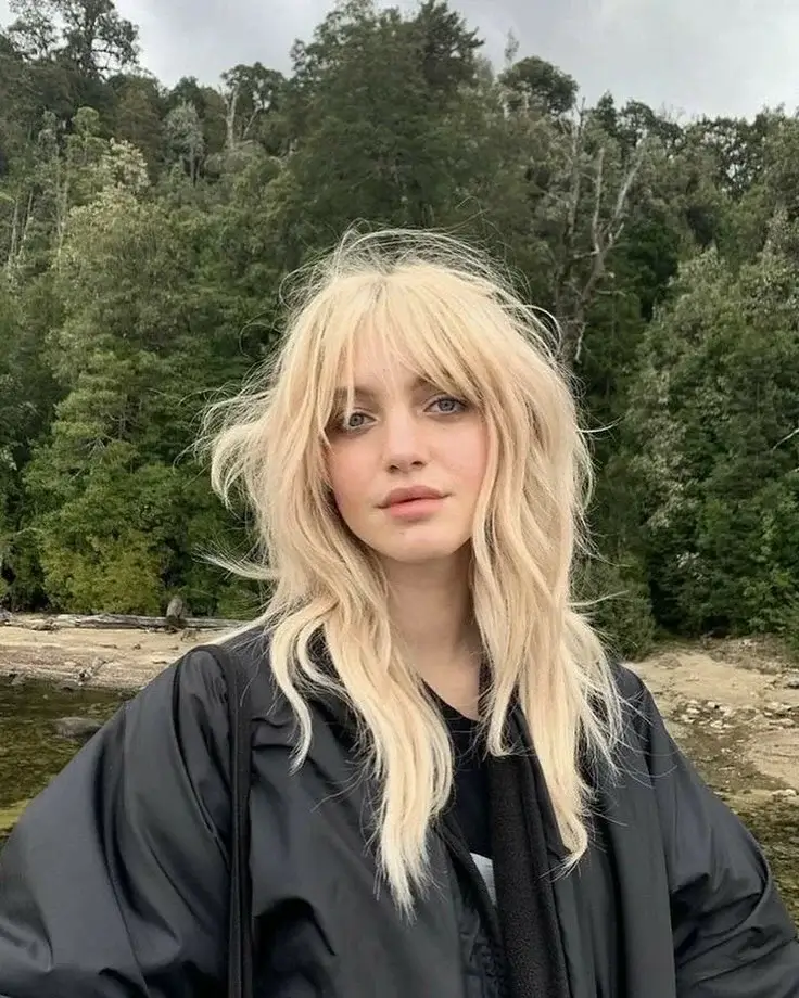 choppy medium layered hair Airy Blonde Wolf Layers With Wispy Fringe