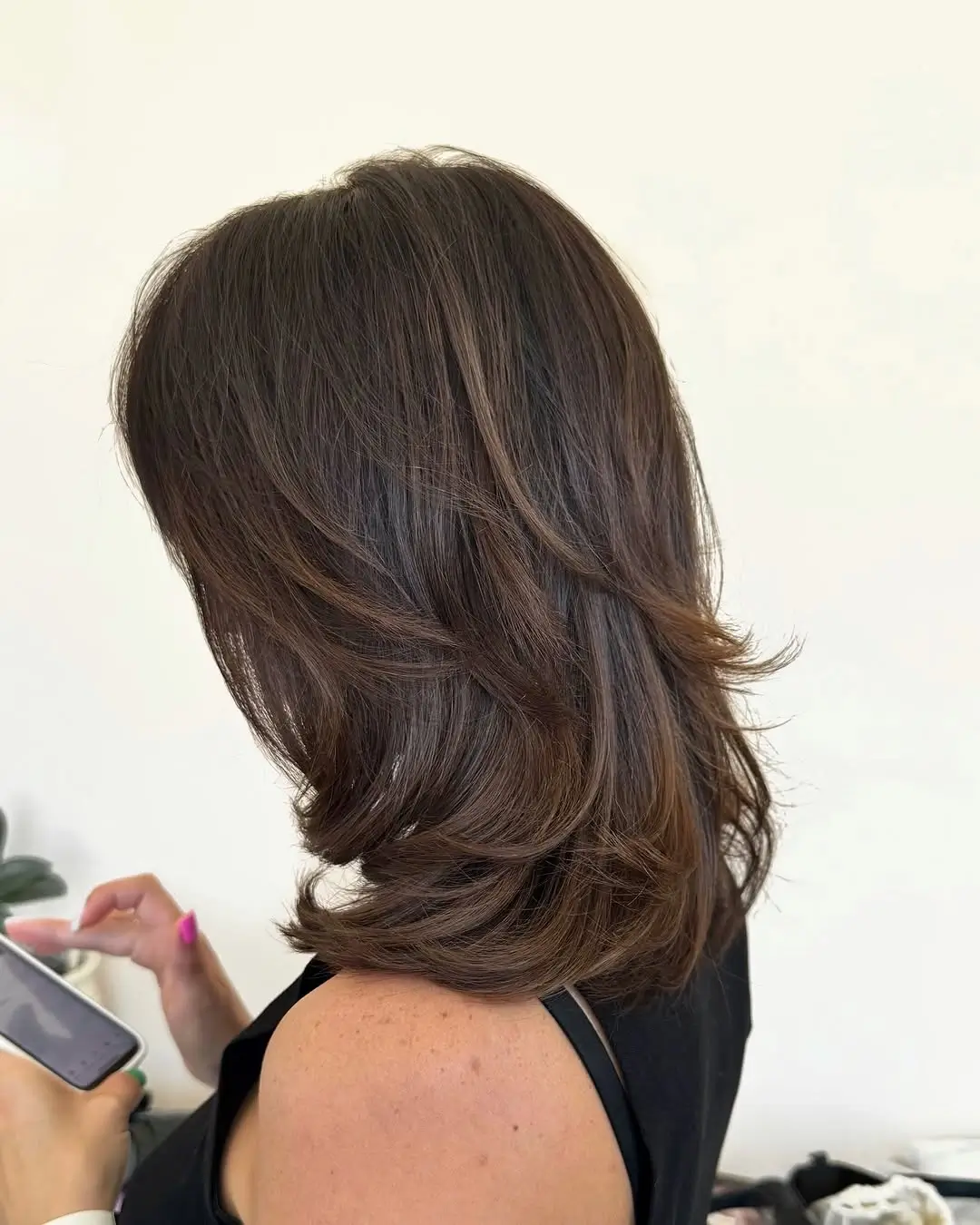 choppy medium layered hair Feathered Chocolate Layers With Soft Flipped Ends