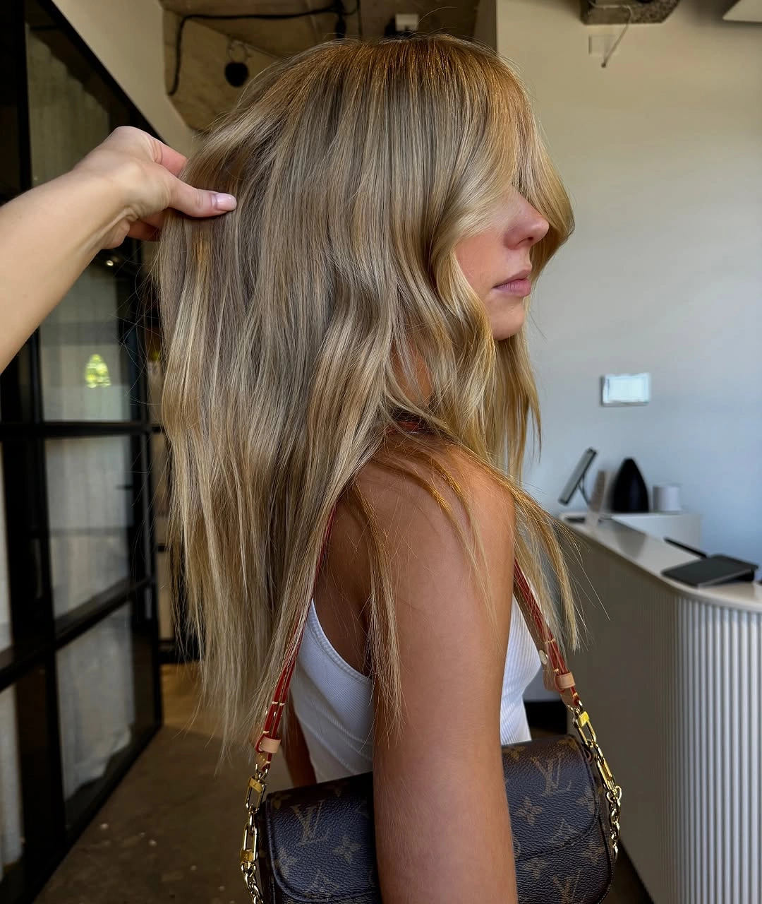 dirty blonde hair color Soft Layered Dirty Blonde with Wispy Curtain Bangs