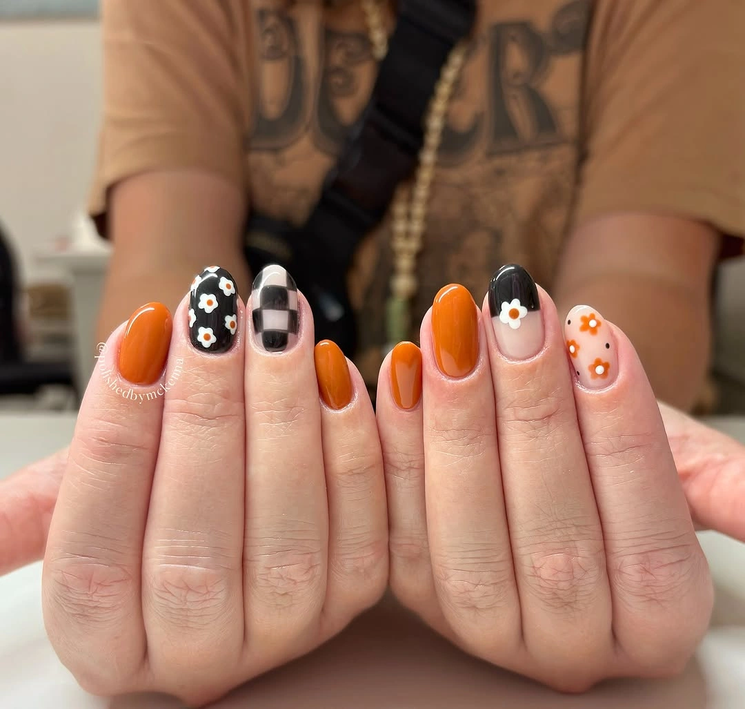 Fall acrylic nails 2026 Retro Floral Acrylic Nails With Pumpkin Orange Accents