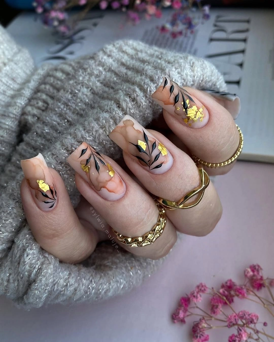 Fall acrylic nails 2026 Elegant Marble Leaf Acrylic Nails With Gold Foil Accents