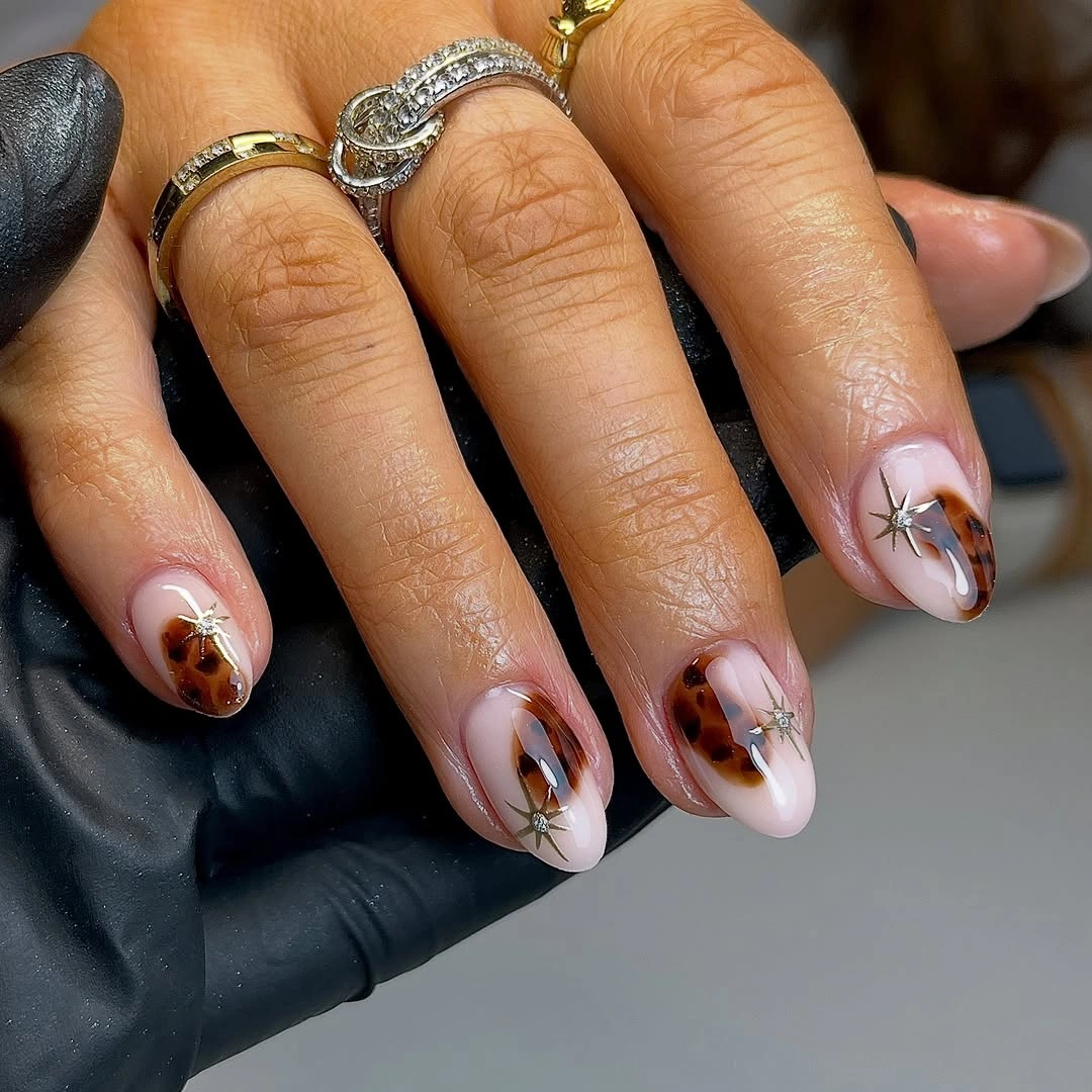Fall acrylic nails 2026 Minimal Tortoiseshell Accent Nails With Delicate Gold Stars