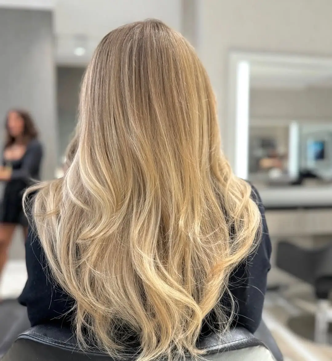 Fall blonde hair colour 2026 Soft Vanilla Blonde With Feathered Layers