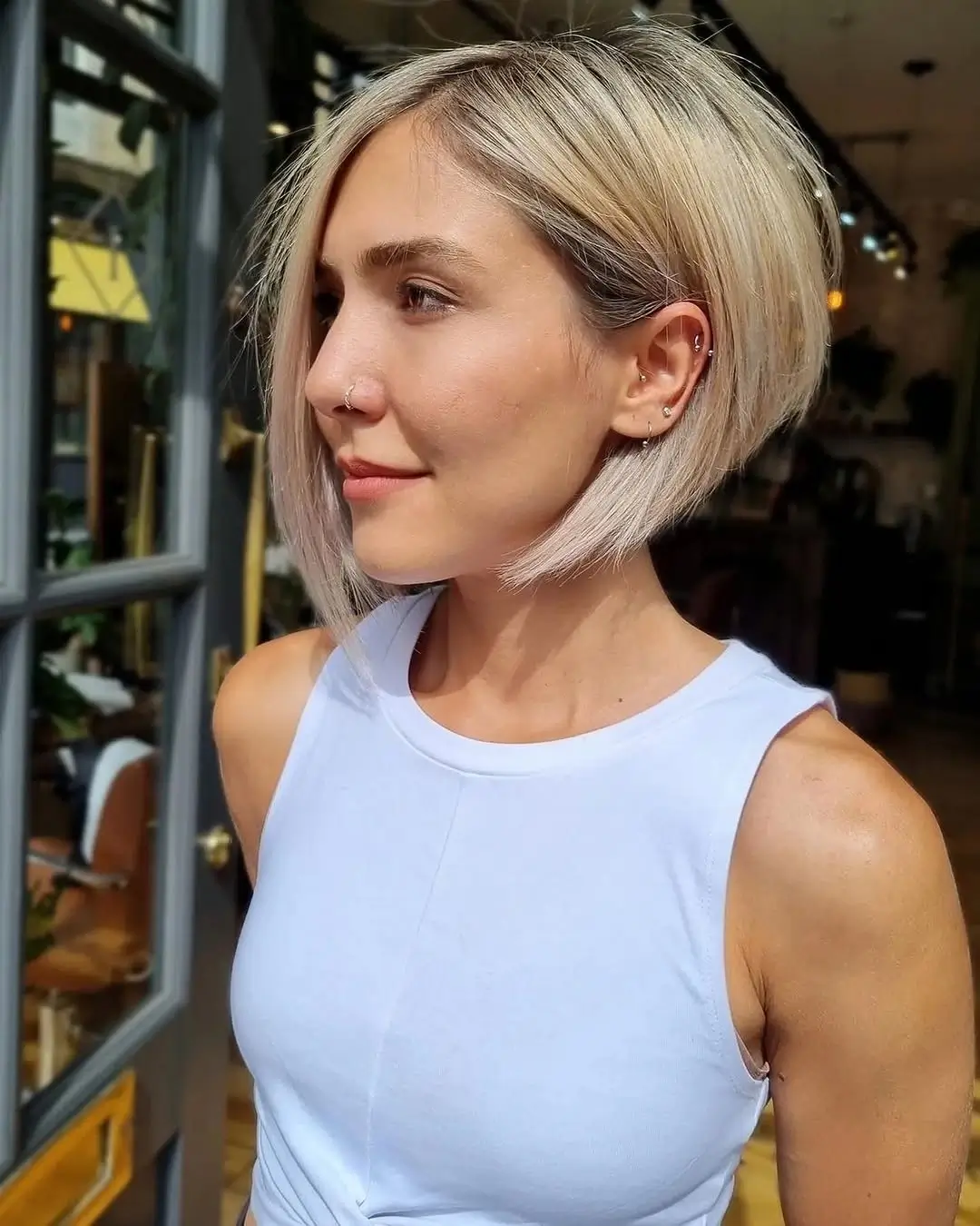 fall bob haircut ideas 2026 Cool Blonde Angled Bob With Sleek Precision