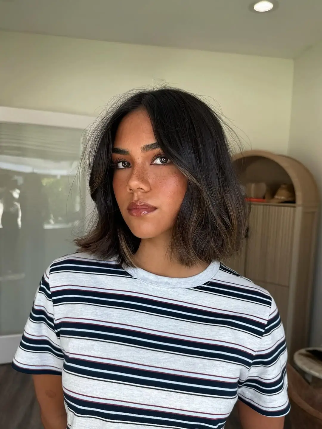 fall French Bob 2026 Glossy Brunette Bob with Subtle Face Framing Highlights