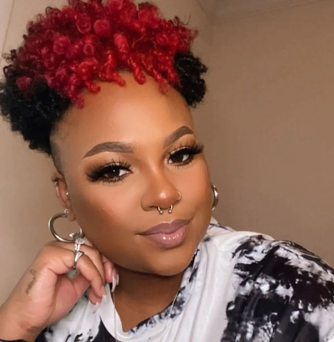fall hair colors for black women 2026 Ruby Red Curls That Brighten a TWA Instantly