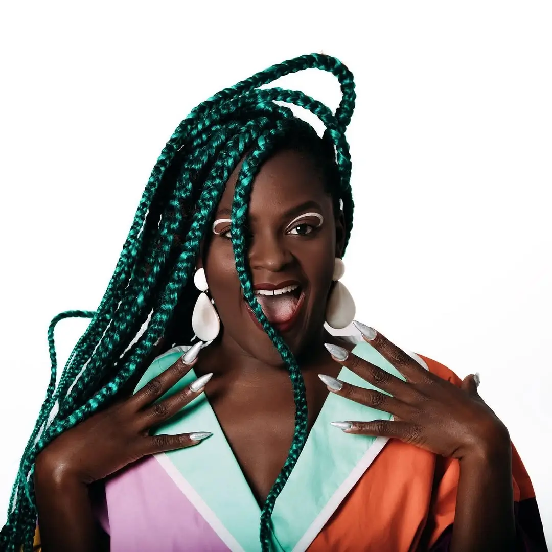 fall hair colors for black women 2026 Jewel Tone Braids With a Dramatic Emerald Finish