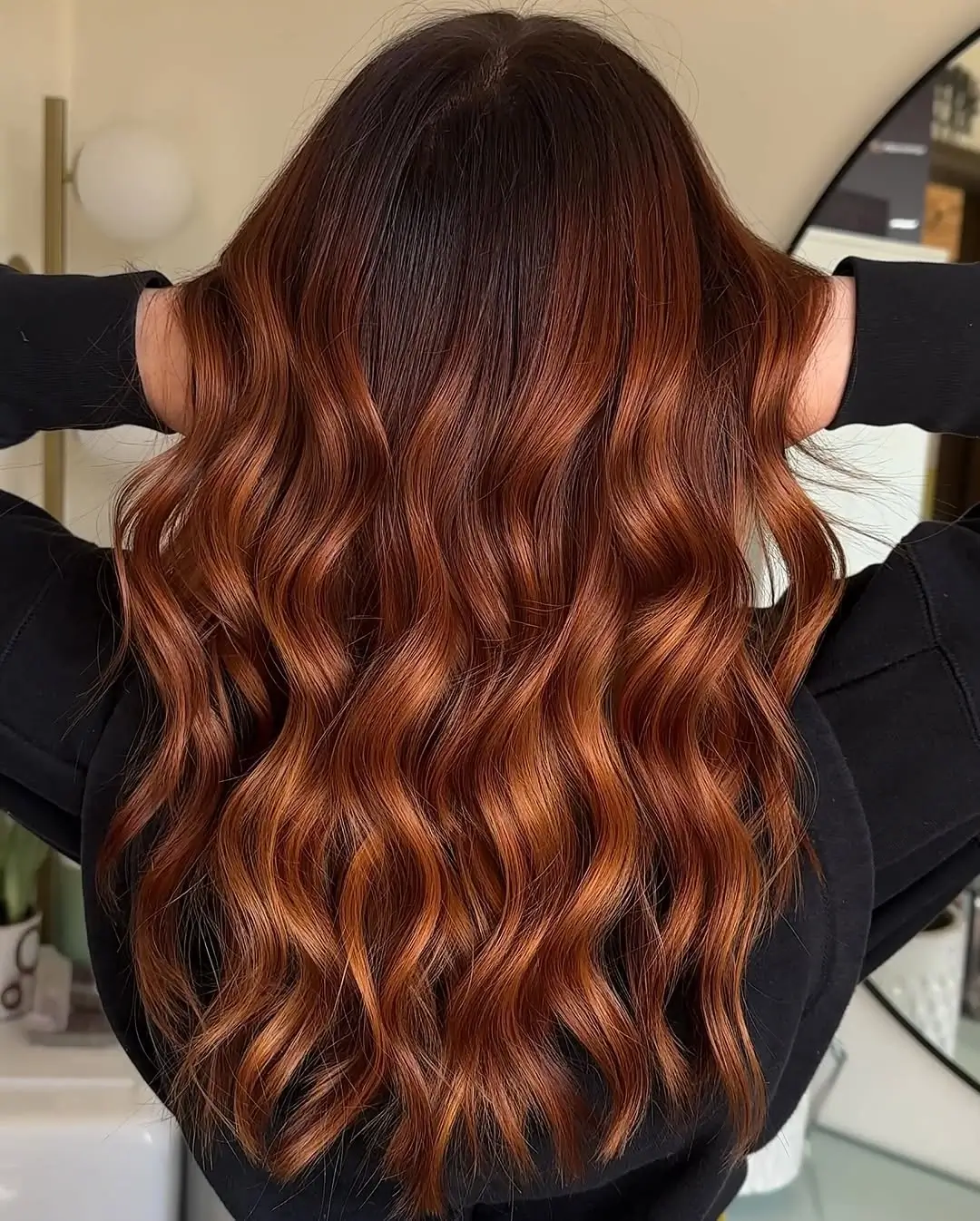 fall hairstyles 2026 Rich Cinnamon Balayage with Glossy Flowing Waves