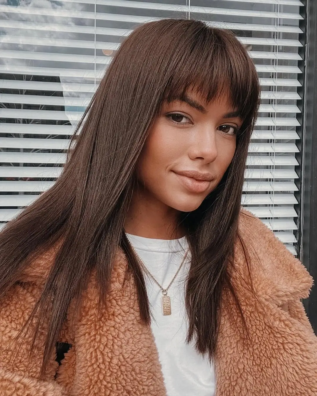 fall hairstyles 2026 Sleek Brunette Layers with Wispy Fringe