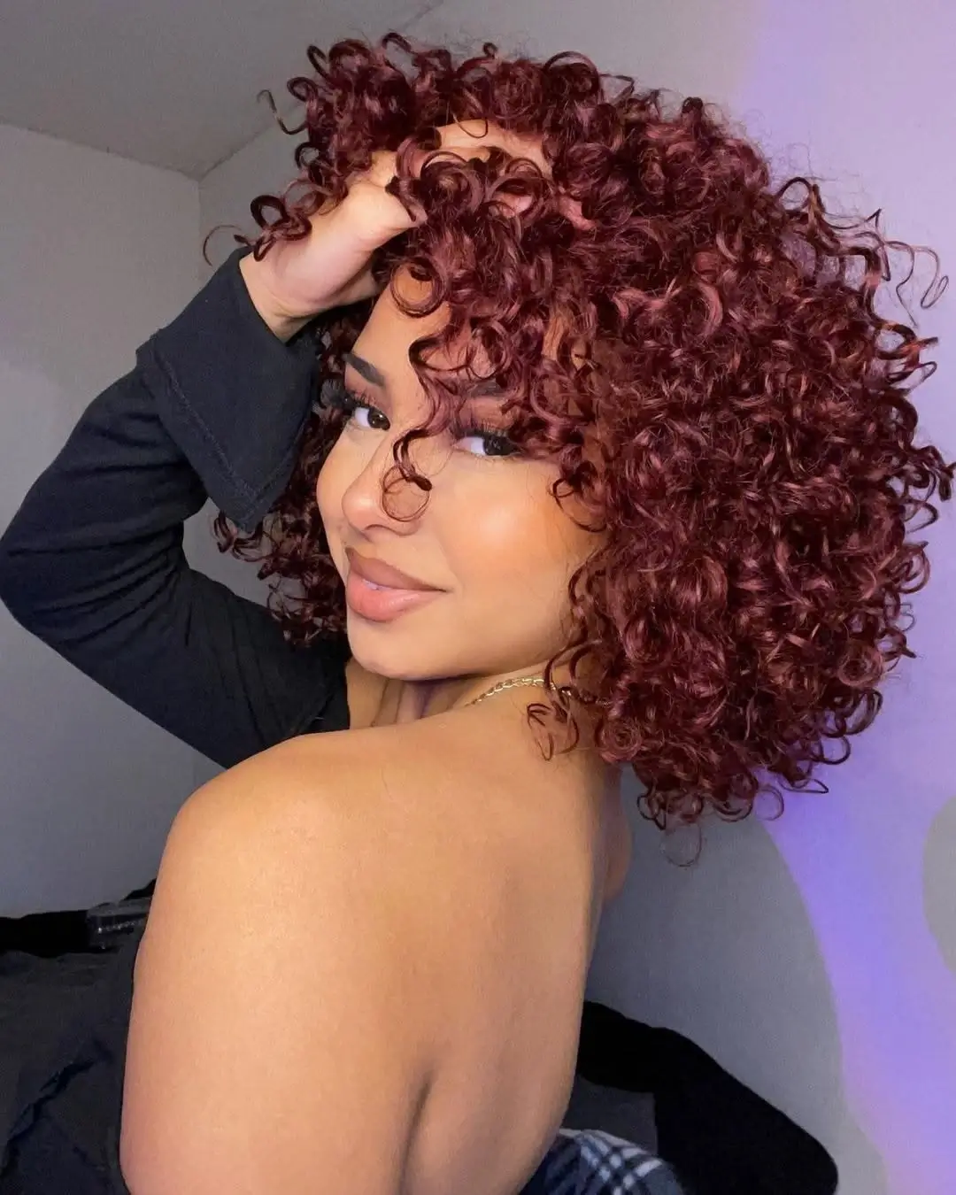 fall hairstyles 2026 Defined Burgundy Curls with Playful Volume