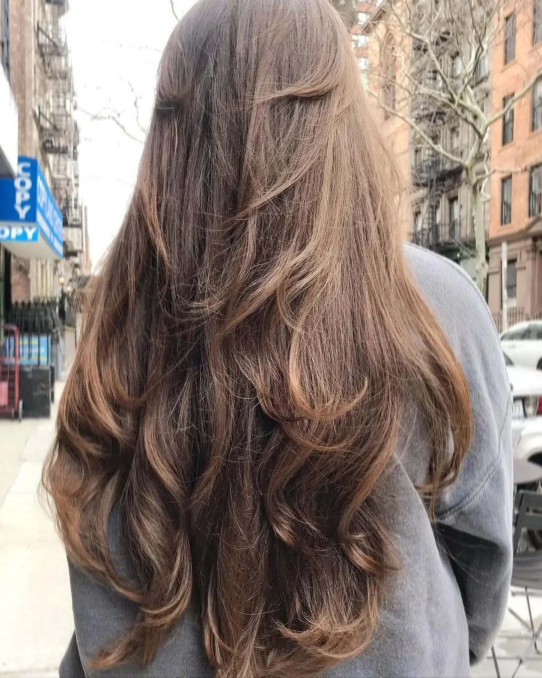 fall hairstyles for long hair 2026 Soft Chocolate Layers With a Relaxed Half Up Twist