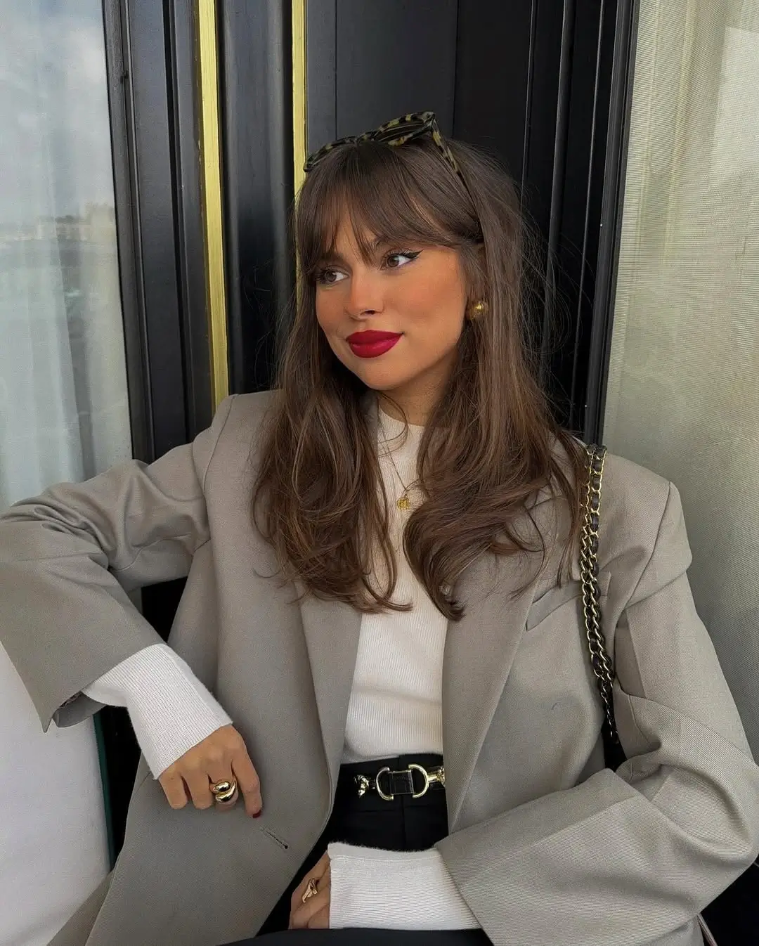 Fall hairstyles for office 2026 Soft Curtain Bangs with a Polished Office Blowout