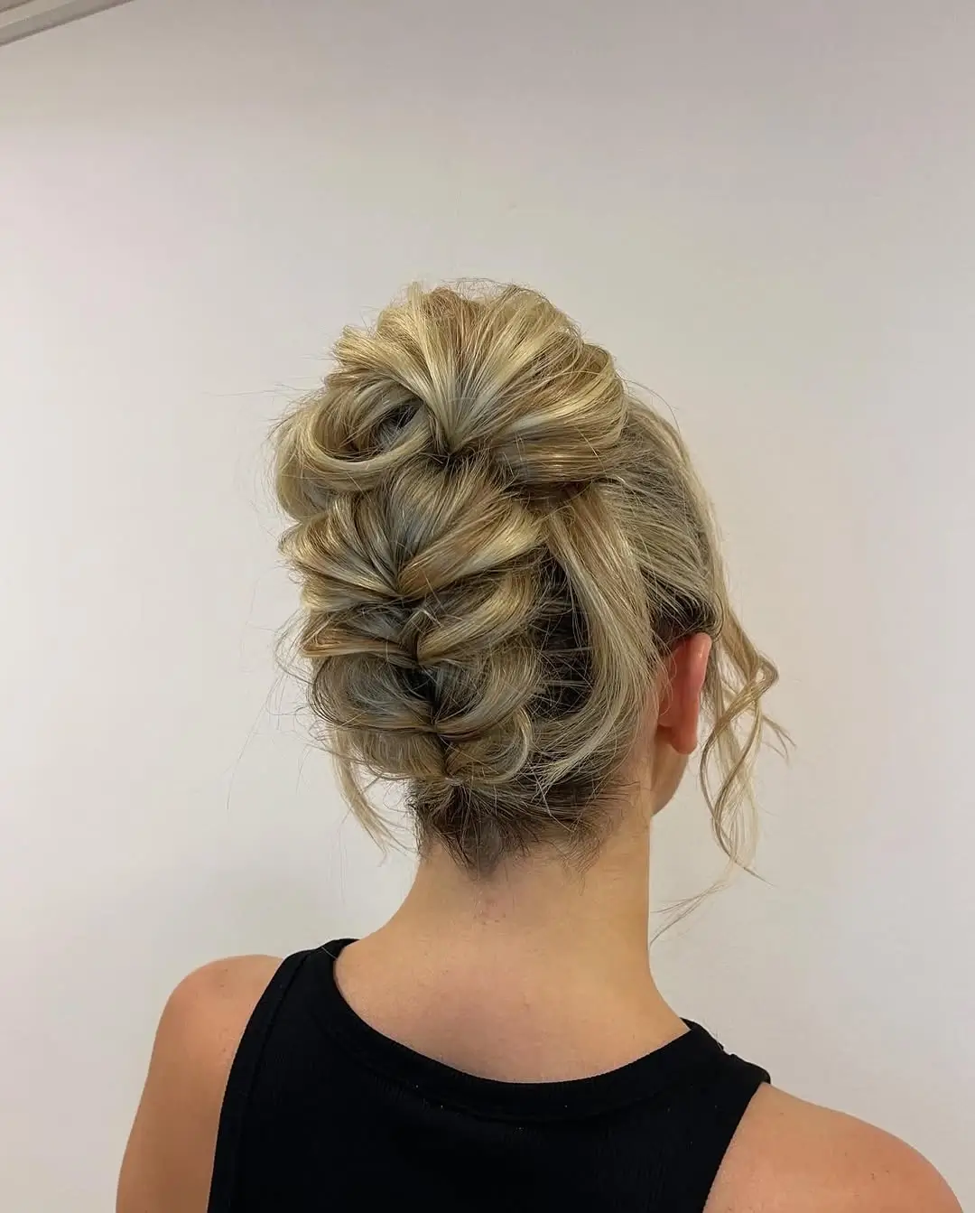 Fall hairstyles for office 2026 An Elegant Braided Updo for Important Office Days