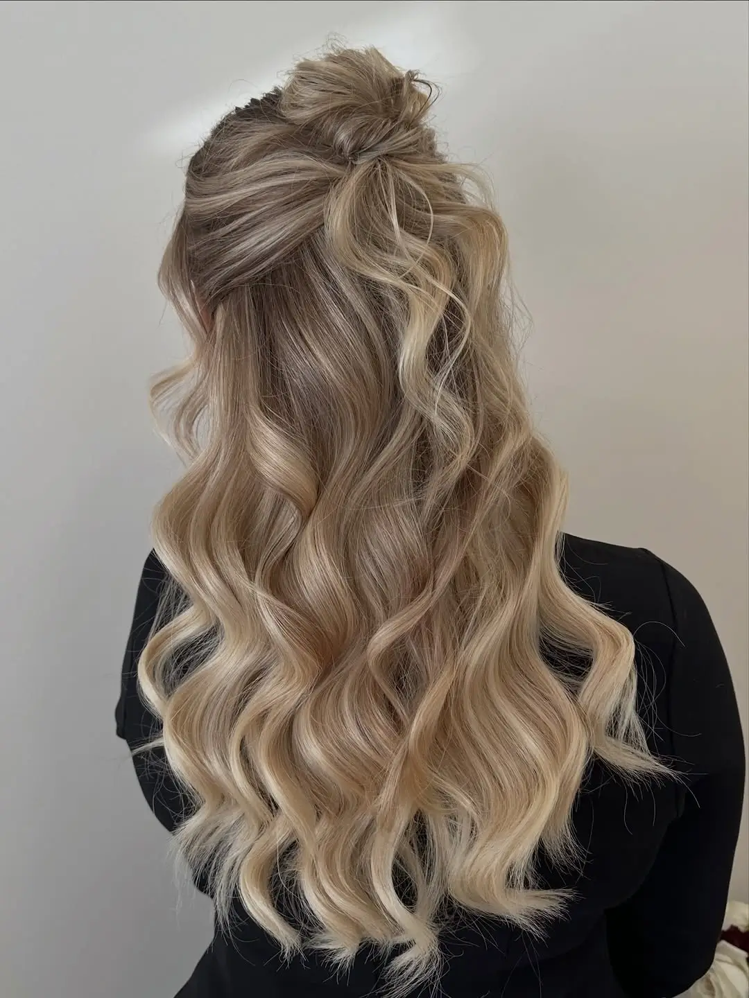 Fall hairstyles for office 2026 A Voluminous Half-Up Style with Soft Blonde Waves