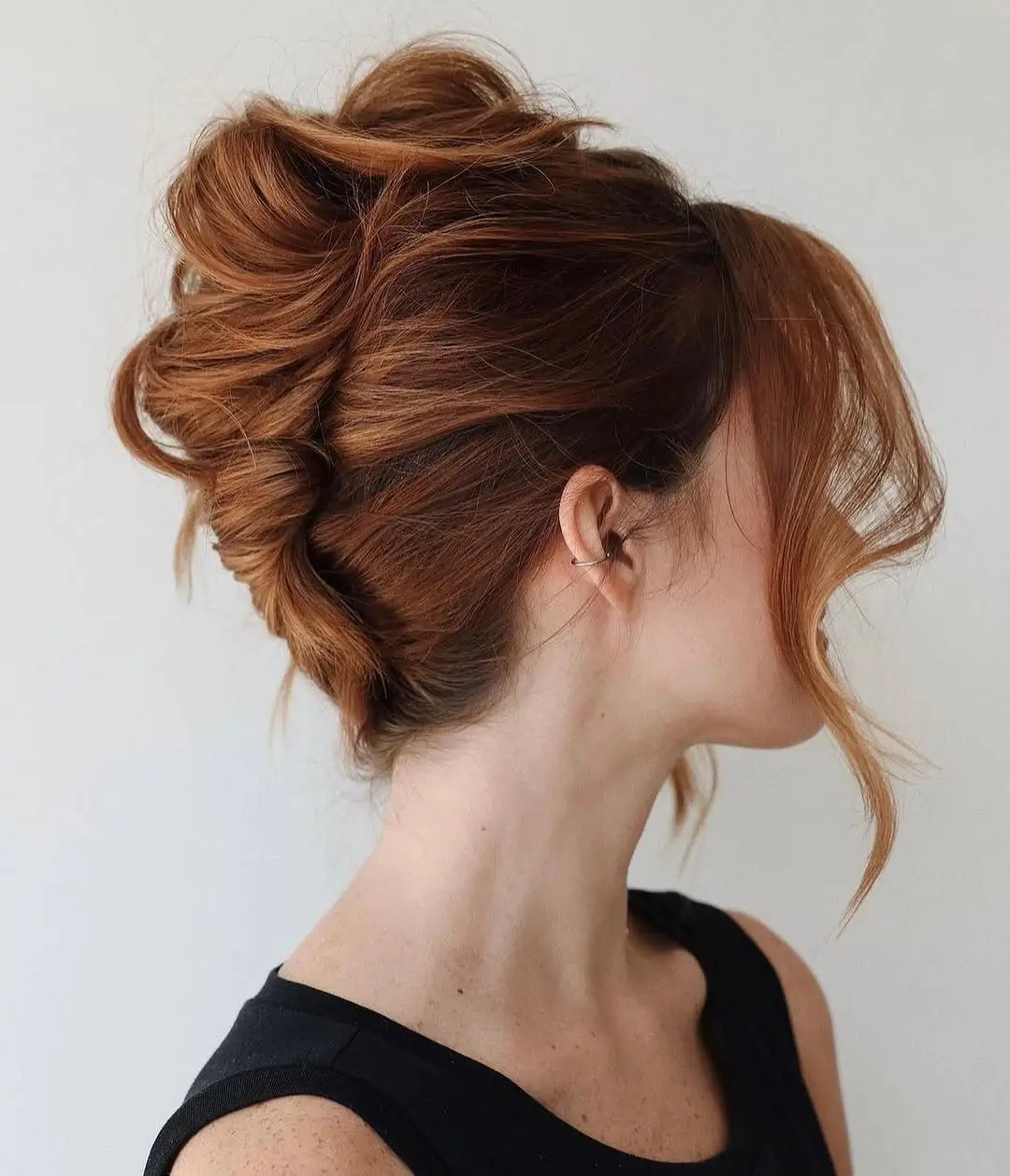 Fall hairstyles for office 2026 A Voluminous Copper Updo That Brightens Every Office Look