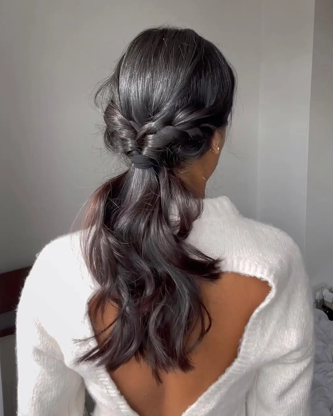 Fall hairstyles for office 2026 A Twisted Low Ponytail with Soft Romantic Waves