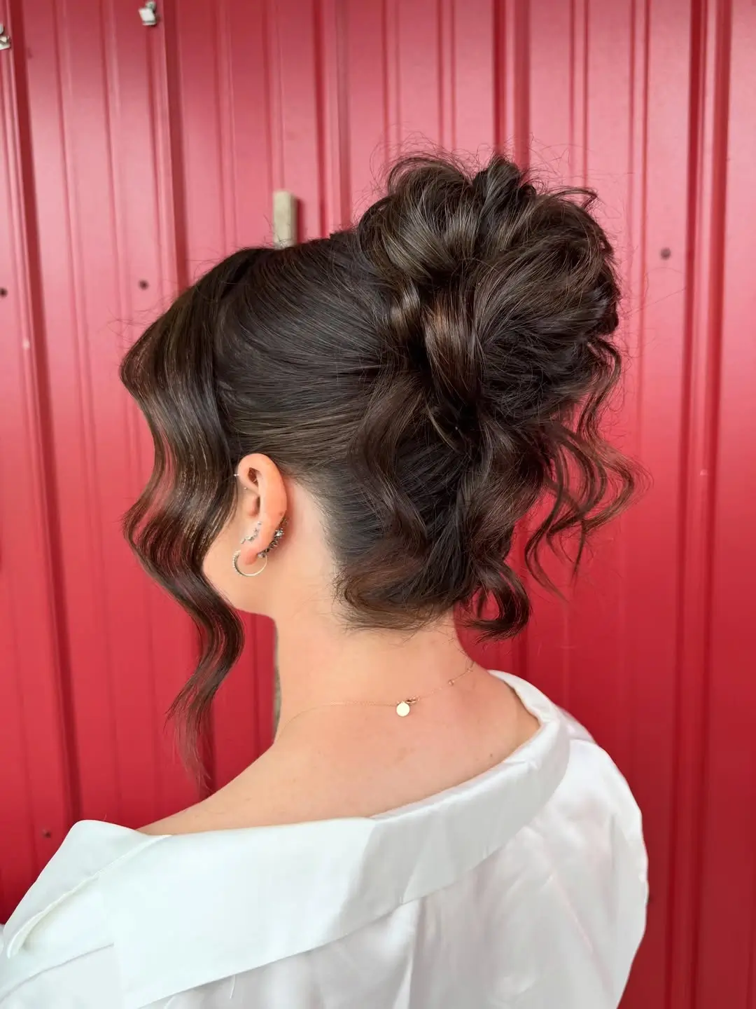 Fall hairstyles for office 2026 A Textured Office Updo with Modern Siren Energy