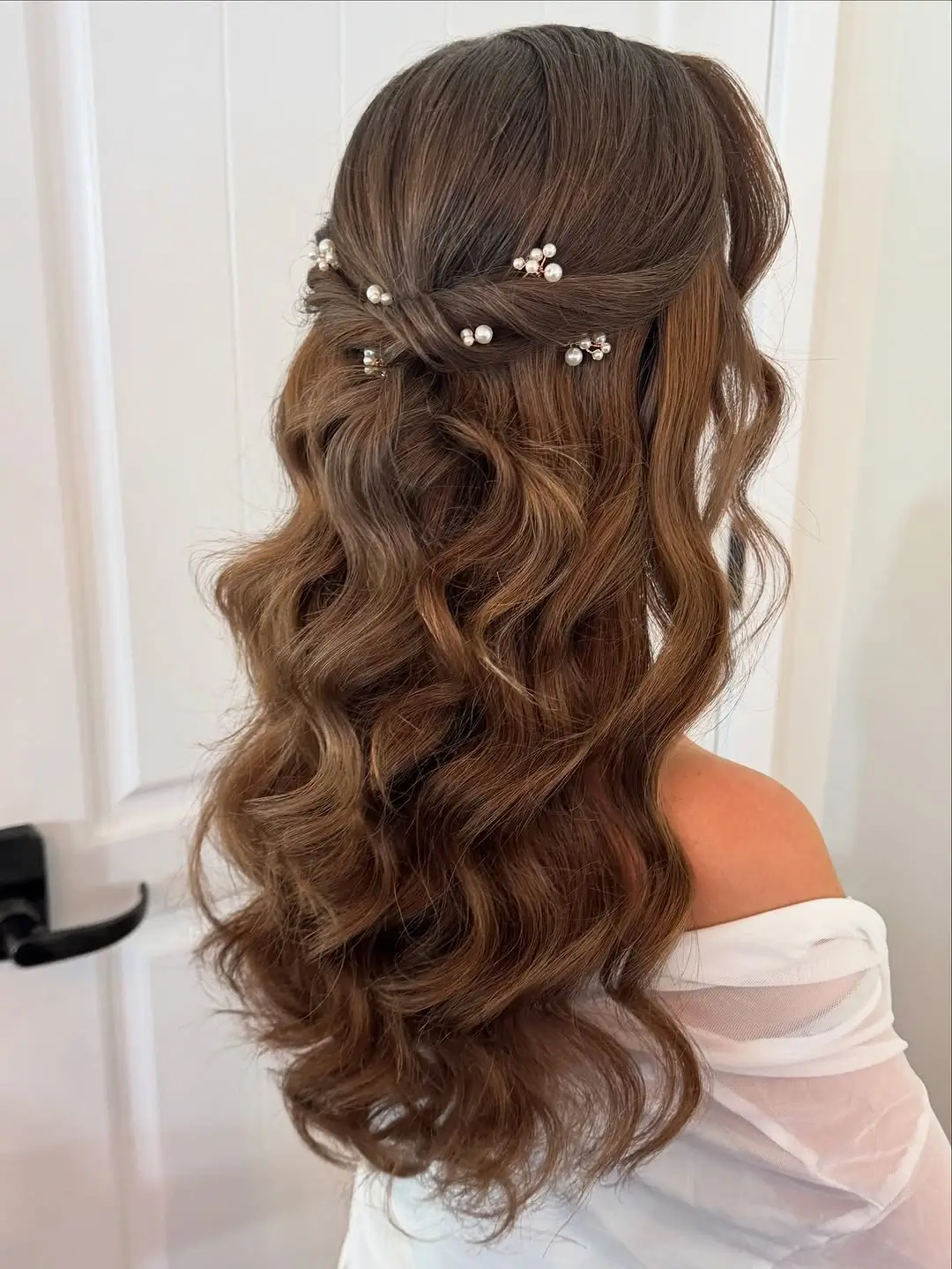 Fall hairstyles for wedding guests 2026 Romantic Half-Up Waves with Delicate Pearl Accents