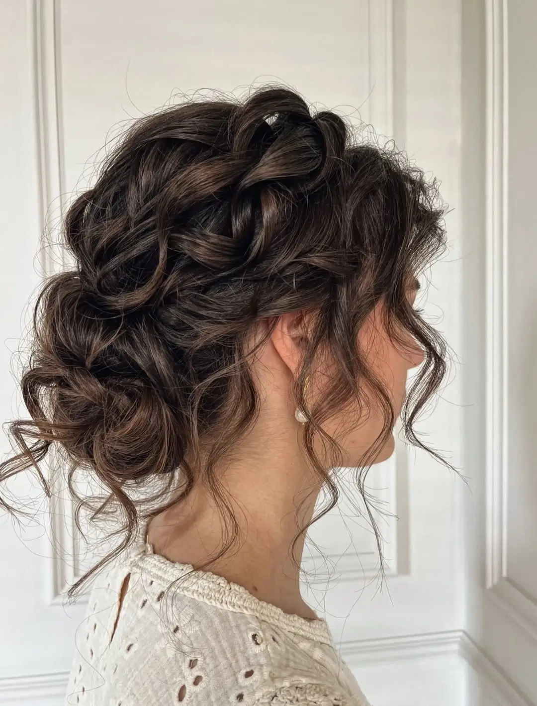 Fall hairstyles for wedding guests 2026 Romantic Textured Updo with Braided Details