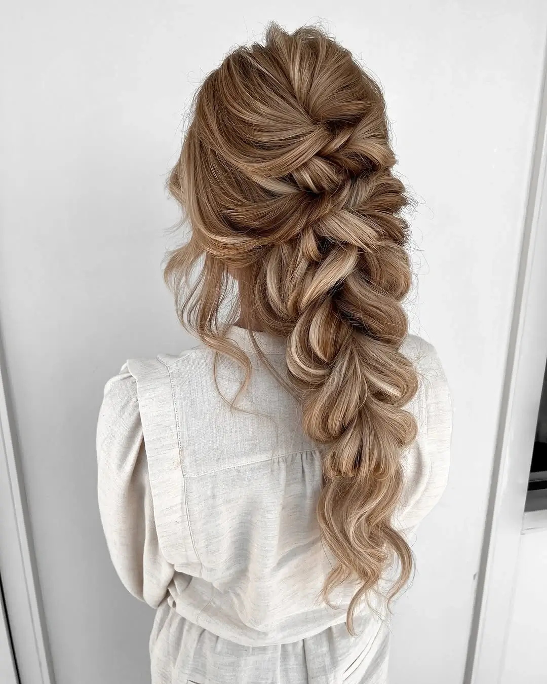 Fall hairstyles for wedding guests 2026 Romantic Bubble Braid with Soft Volume
