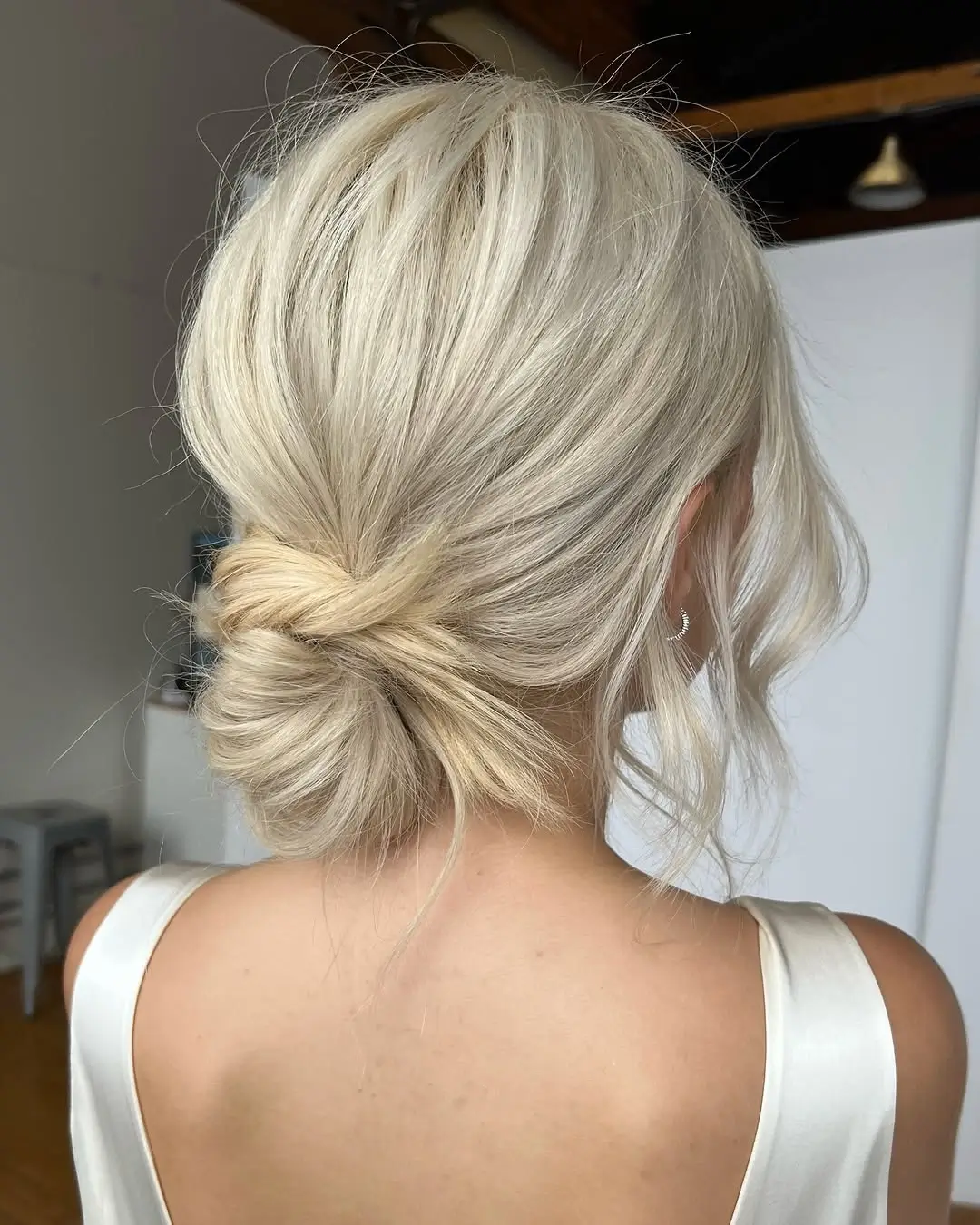Fall hairstyles for wedding guests 2026 Classic French Twist with Modern Softness