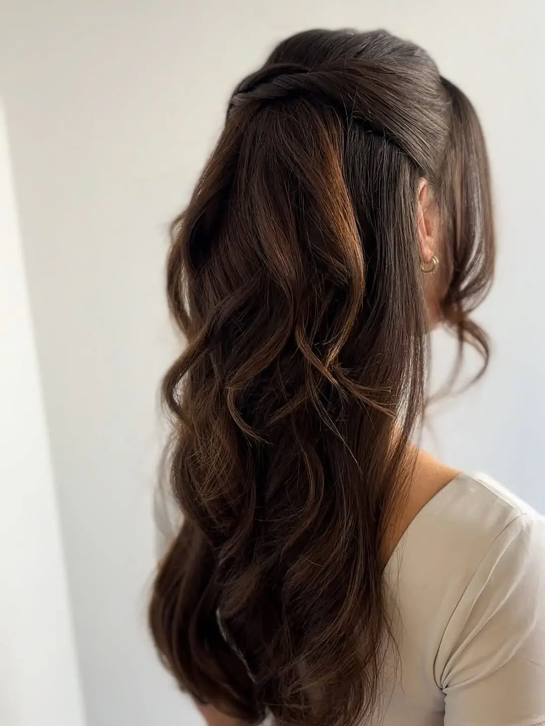 Fall hairstyles for wedding guests 2026 Soft Half-Up Twist for Effortless Brunette Waves