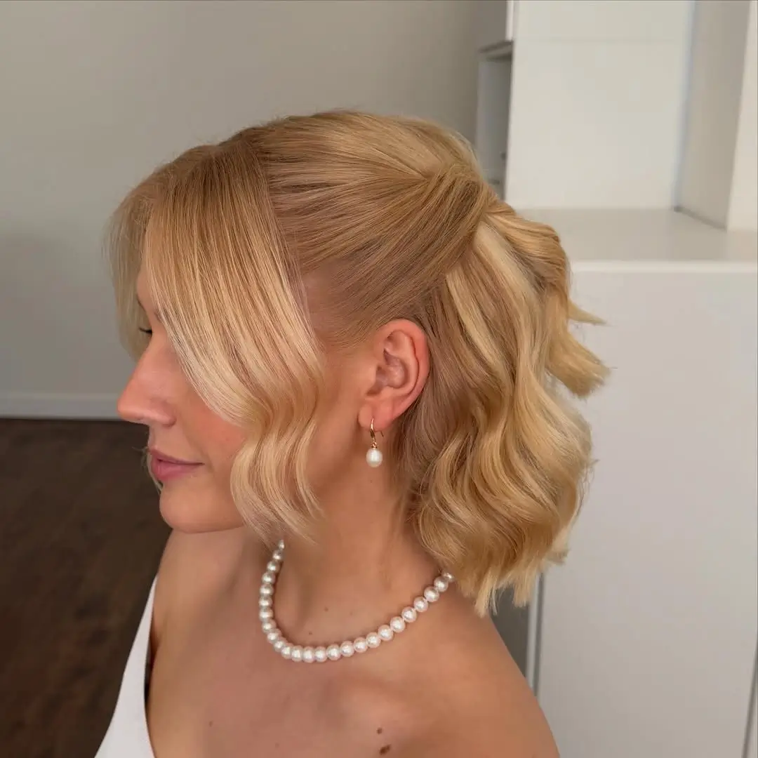 Fall hairstyles for wedding guests 2026 Elegant Half-Up Bob with Vintage Waves