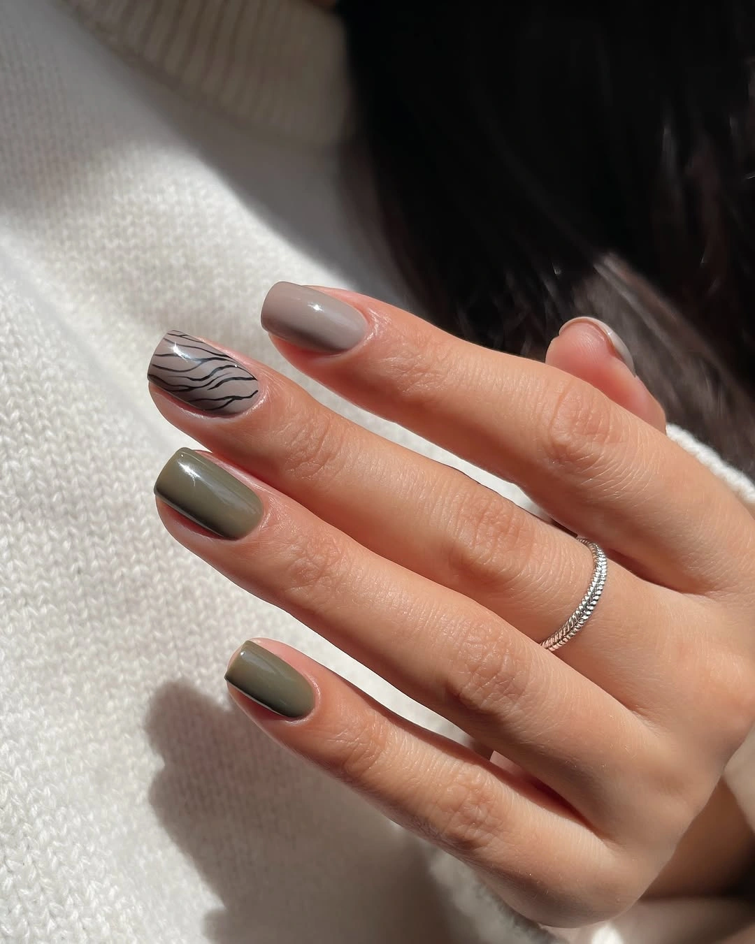 Fall medium nail ideas 2026 Olive and Greige Nails With Modern Zebra Accent Art