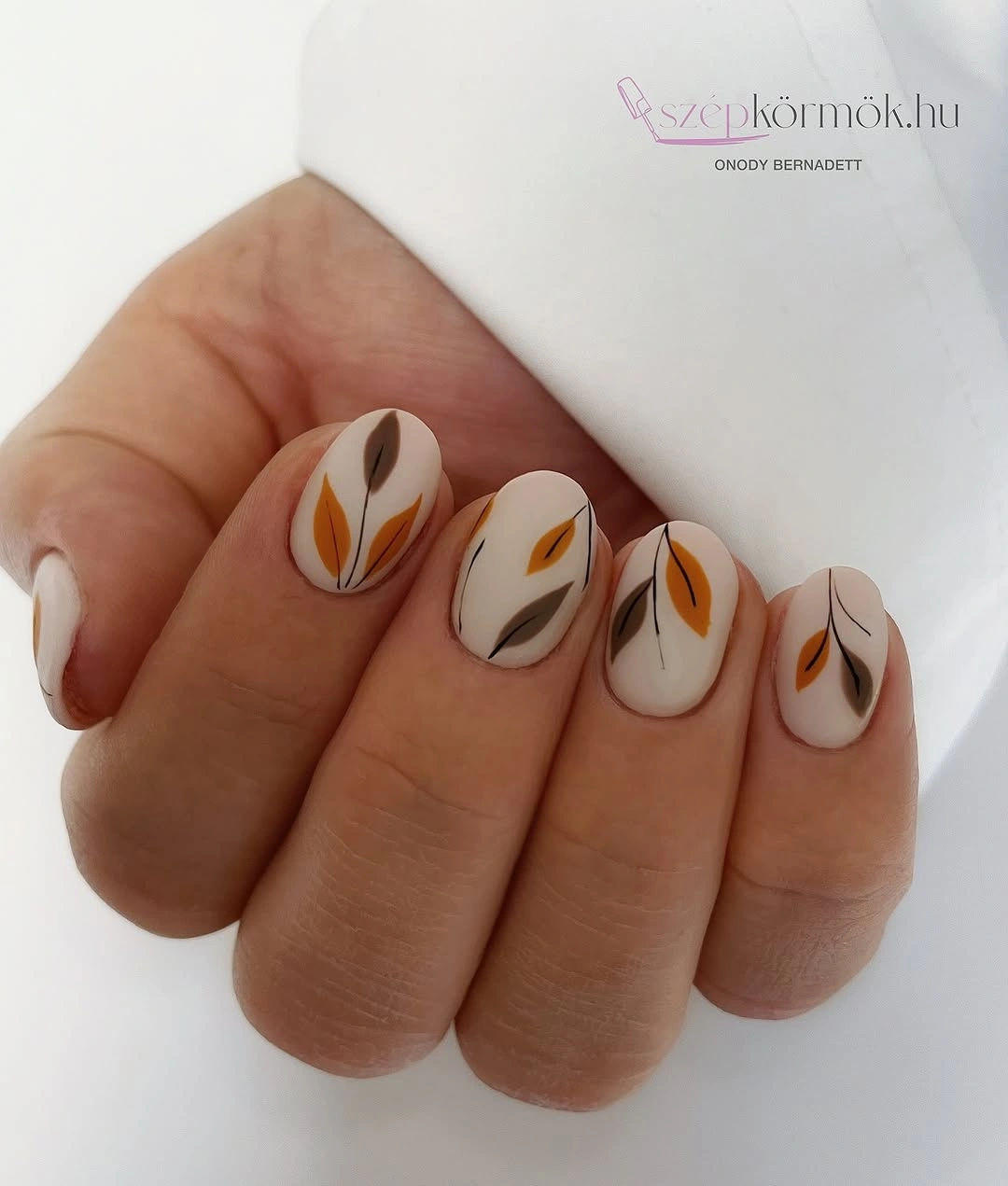 Fall medium nail ideas 2026 Minimal White Nails With Delicate Autumn Leaves