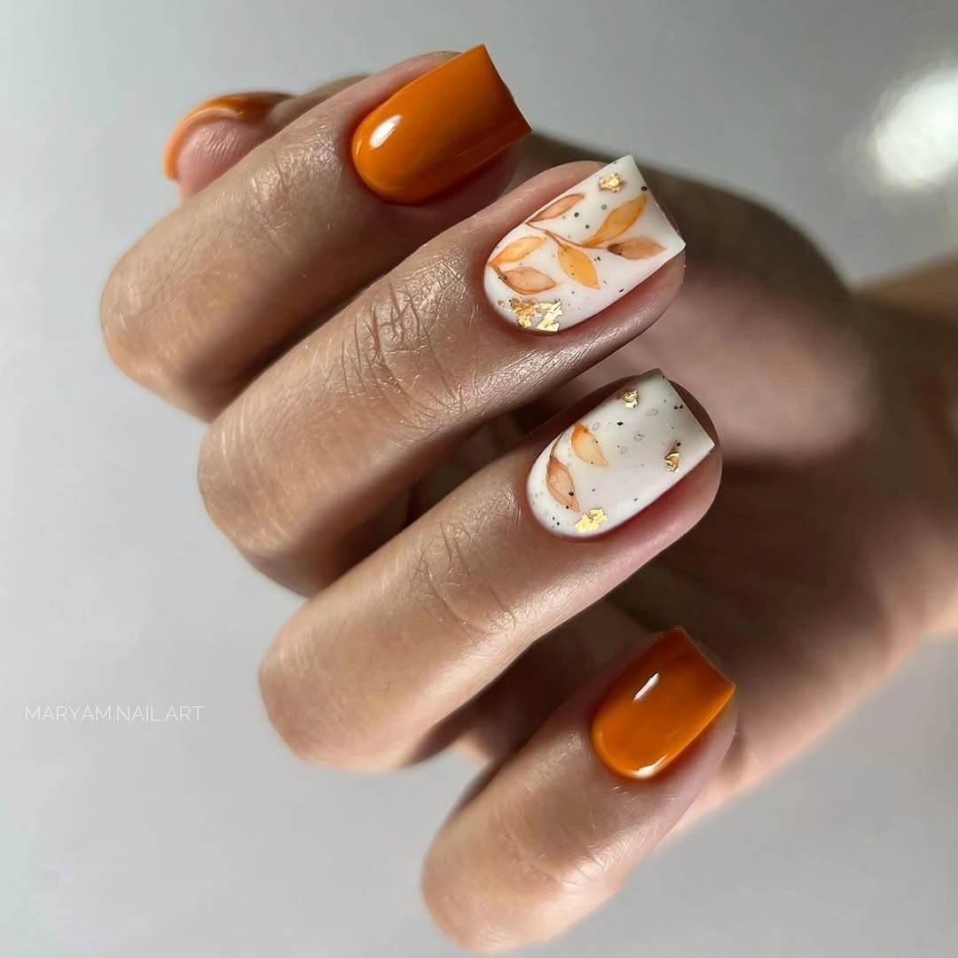 Fall nail art 2026 Burnt Orange Botanical Nails with Gold Foil Details