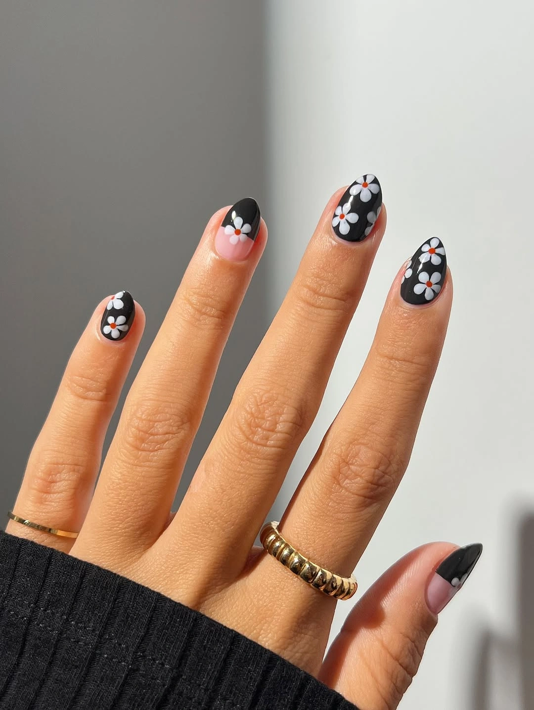 Fall nail art 2026 Black Daisy Nails with a Modern Graphic Twist