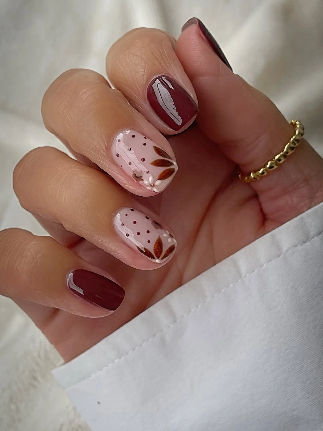 Fall nail art 2026 Soft Pumpkin Leaf Nails with Elegant Gold Accents