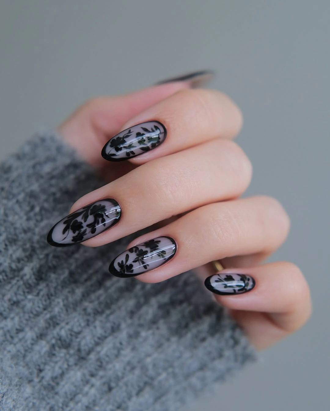 Fall nail art 2026 Smoky Black Floral Nails with Modern Botanical Elegance