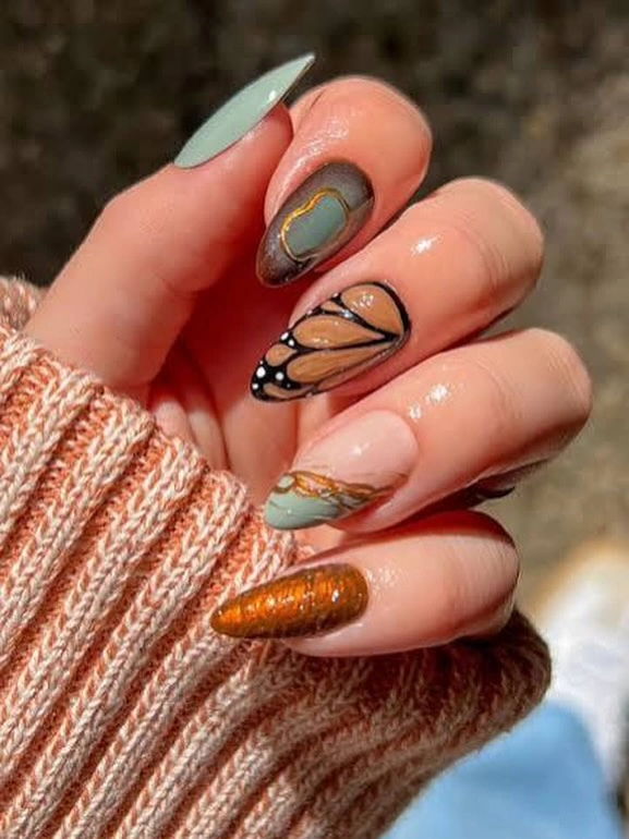 Fall Nail Designs for All Skin Tones 2026 Muted Sage and Copper Butterfly Nails With Artistic Autumn Charm