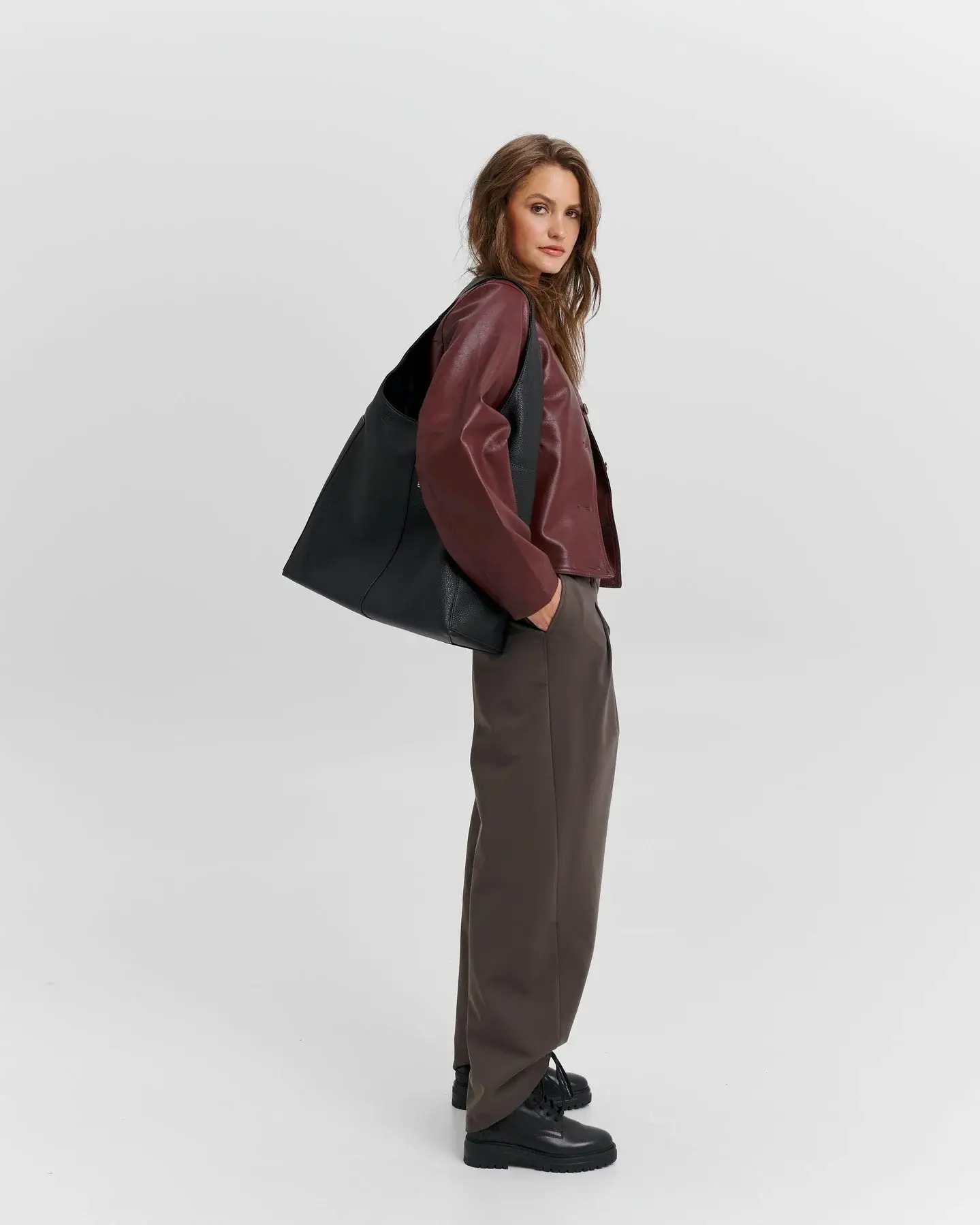 fall office outfits for women 2026 Burgundy Leather Jacket with Relaxed Tailored Trousers